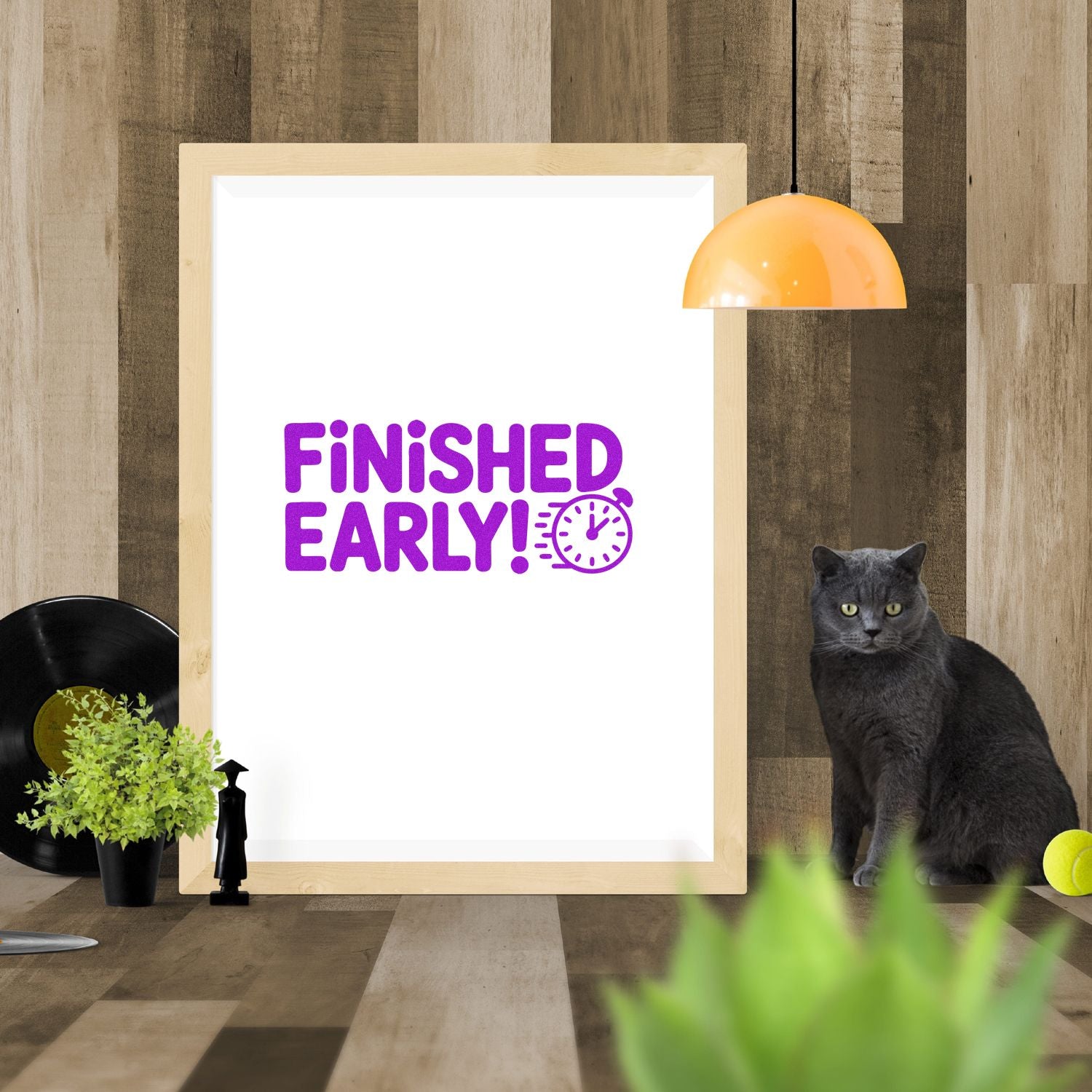 Purple Finished Early! stamp and seal design with clock icon on a white framed print against wood paneling.