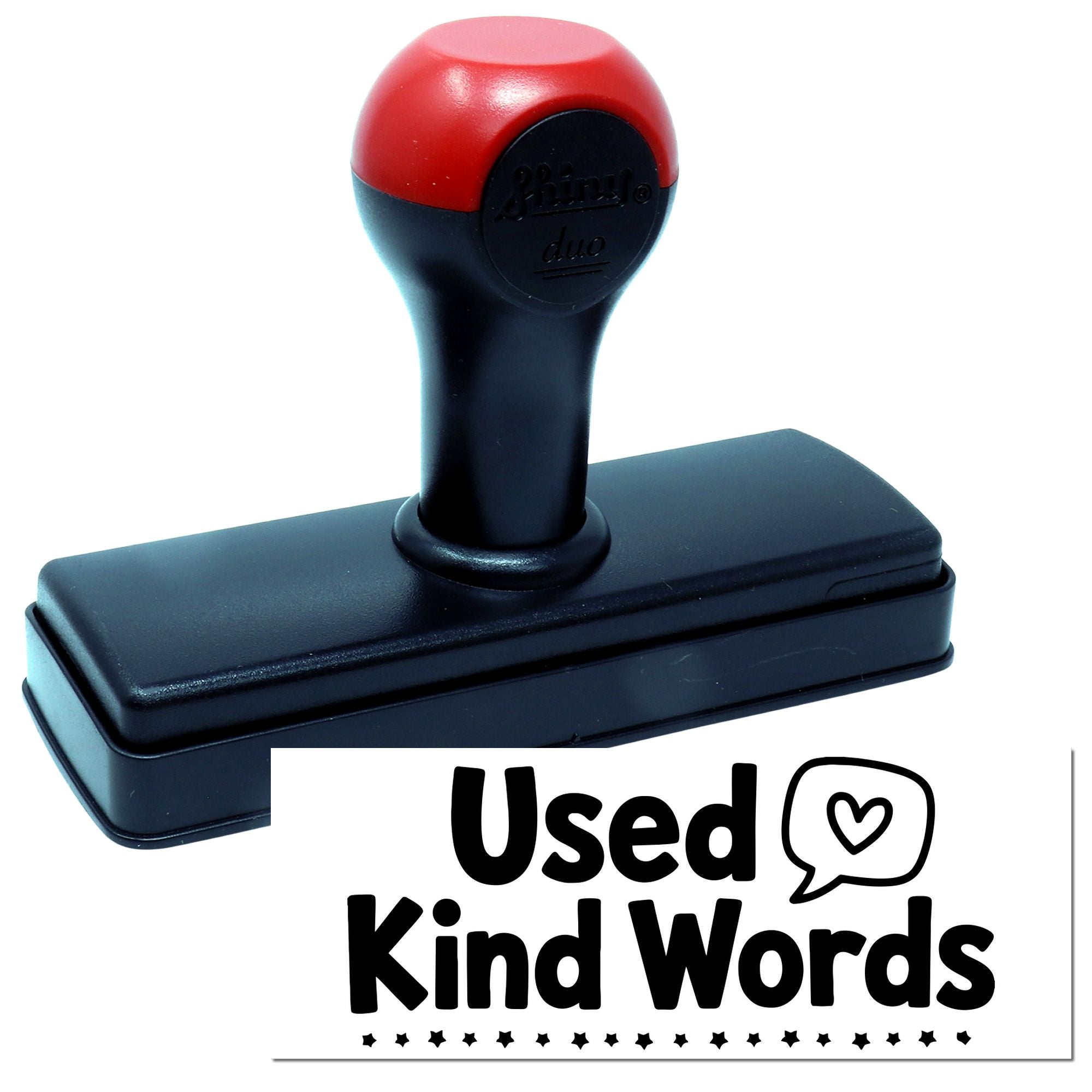 Black and red self-inking stamp and seal with rounded handle, showing Used Kind Words text graphic.