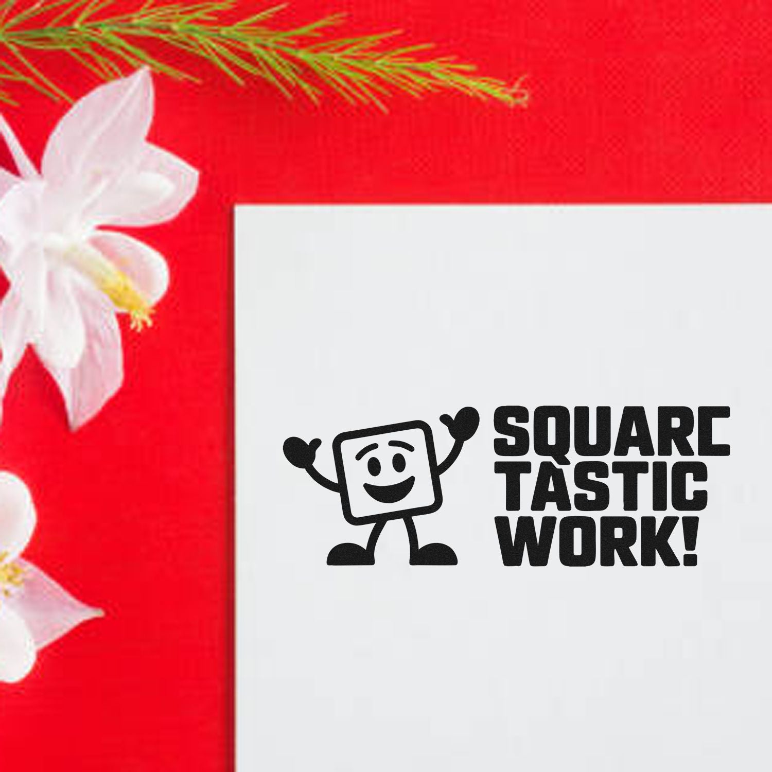 Black Square Tastic Work! stamp seal on a white card, set on a bright red background with white flower accents.