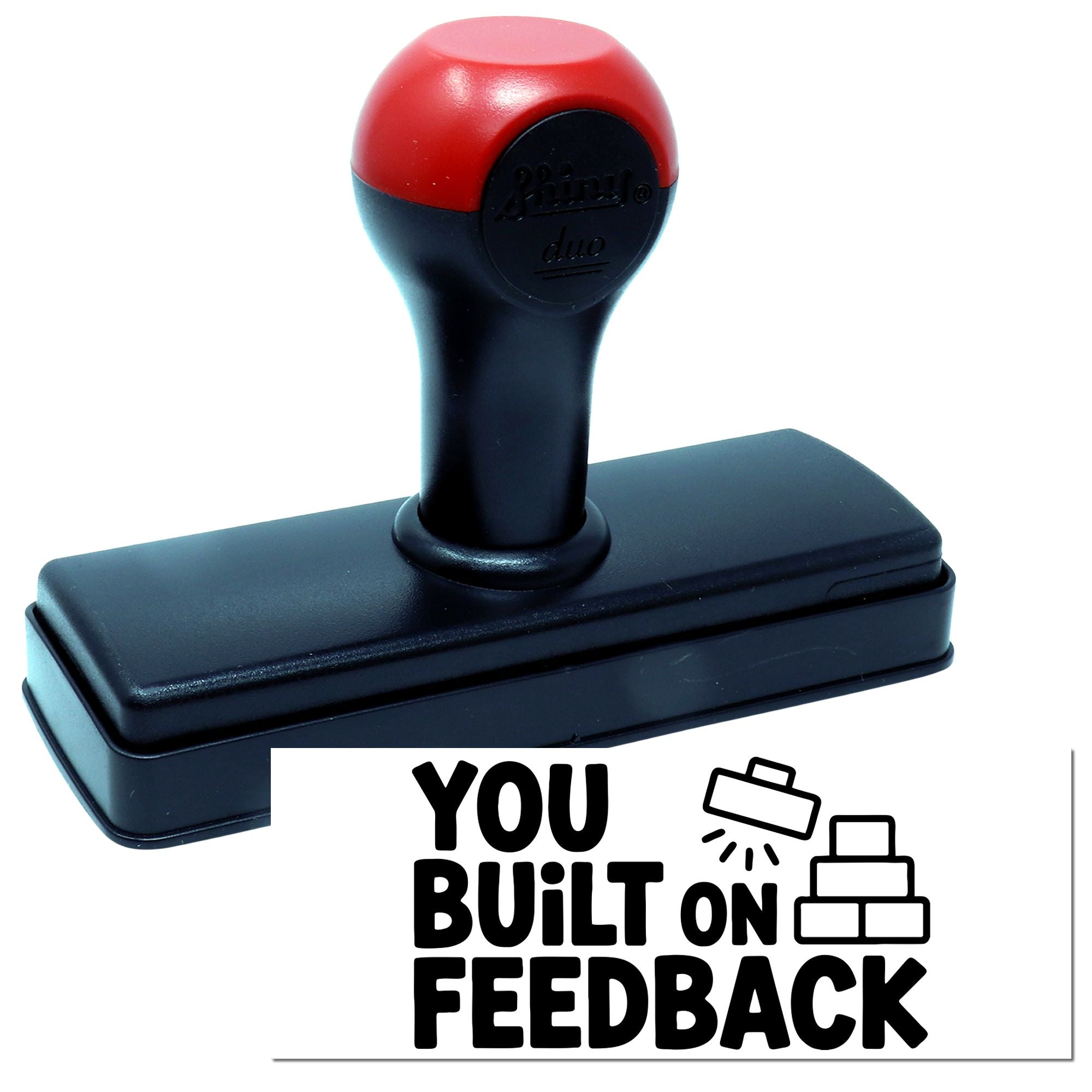Red and black self-inking stamp seal with rectangular base and built-on feedback logo on white.