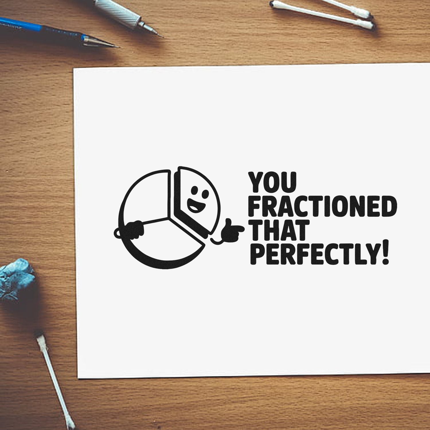 Custom stamp and seal design with black pie-chart character and text You fractioned that perfectly! on white paper.