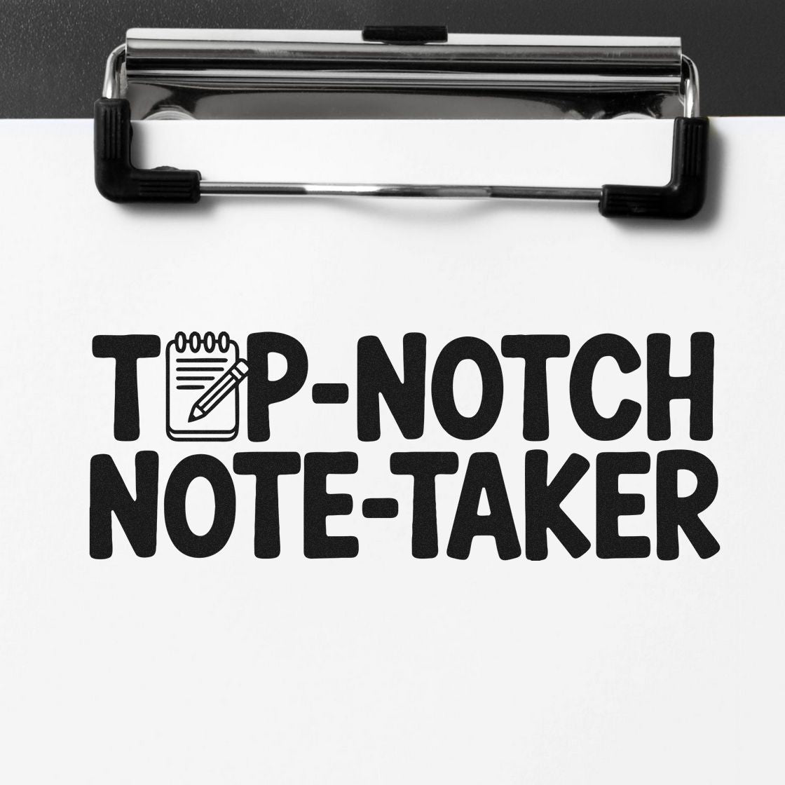 Black TOP-NOTCH NOTE-TAKER stamp/seal on white paper, clipped to a chrome clipboard with a notebook-and-pencil icon.