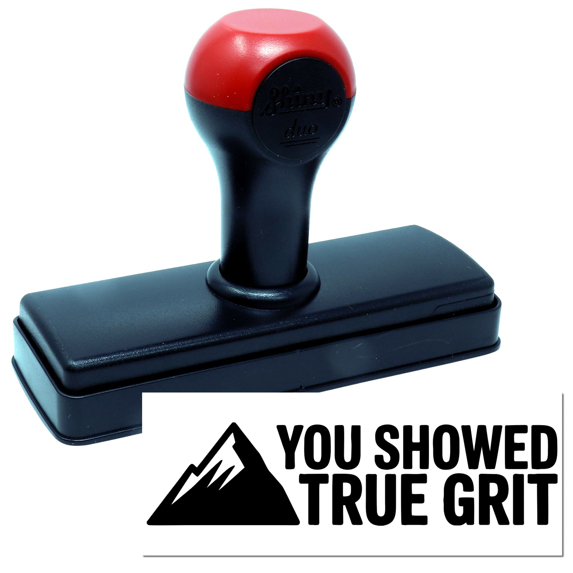 Red and black self-inking stamp with rectangular base and You Showed True Grit seal logo.