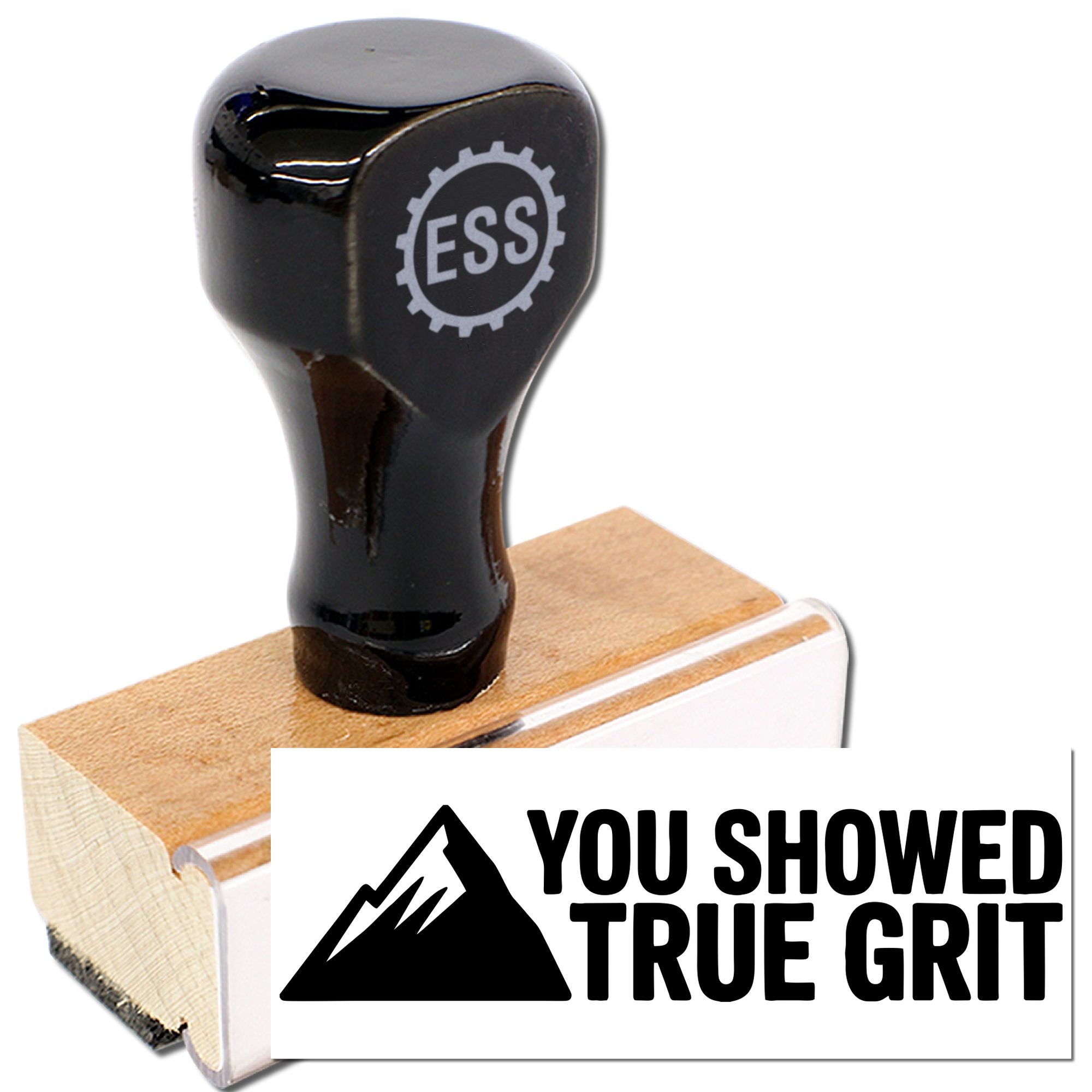 Black ESS stamp on wooden base with You Showed True Grit seal and mountain logo
