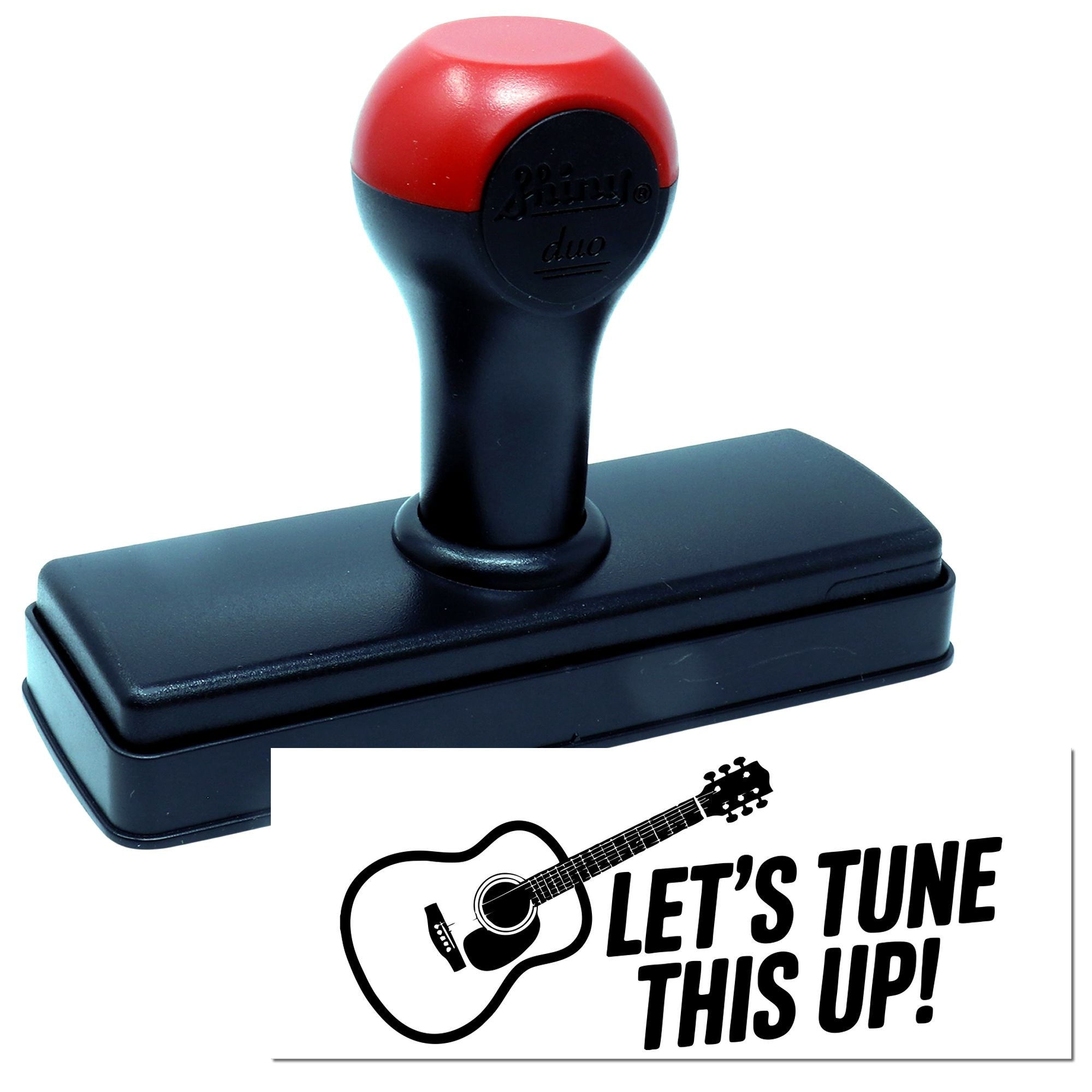 Red and black self-inking stamp and seal with guitar logo and LETS TUNE THIS UP! text on white background.