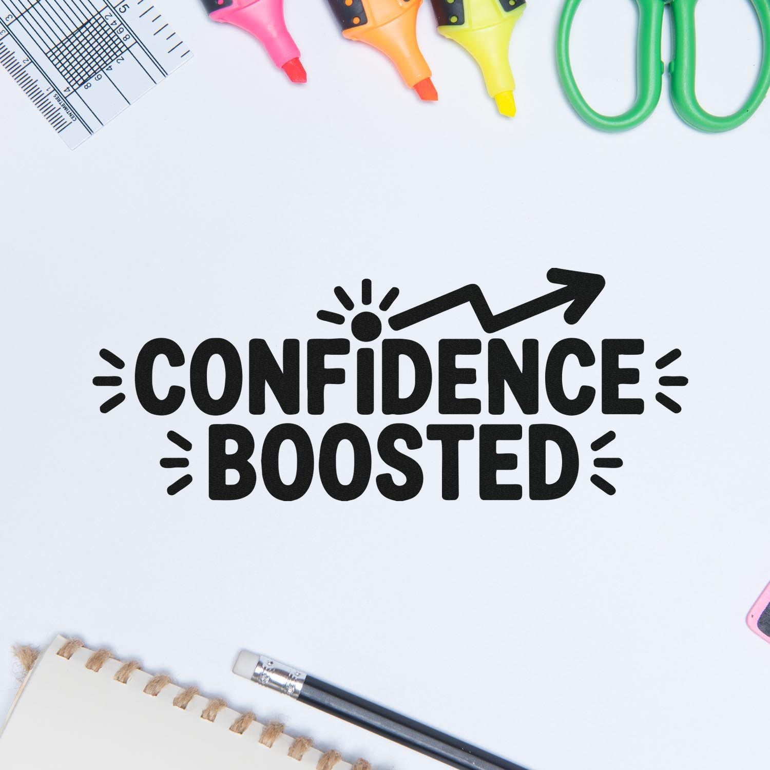 Black CONFIDENCE BOOSTED stamp with pink, orange, yellow markers, green scissors, ruler, and pencil on white background.