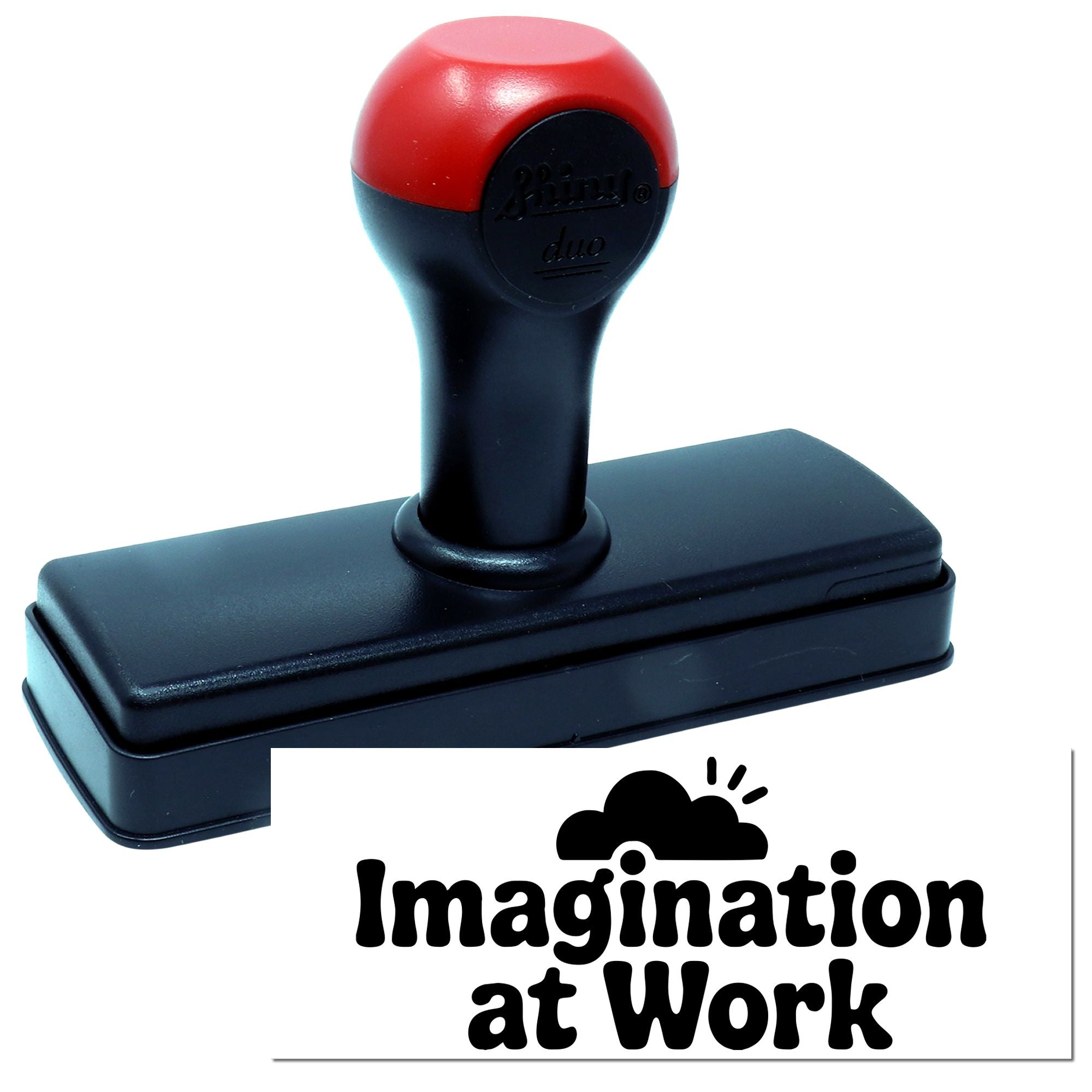 Red and black self-inking rubber stamp seal with rectangular base and Imagination at Work logo