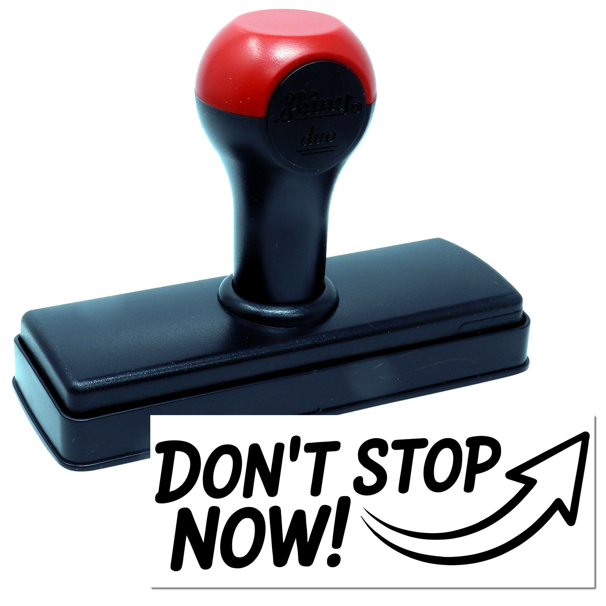 Black self-inking rubber stamp with red handle and DONT STOP NOW! seal graphic on white background.