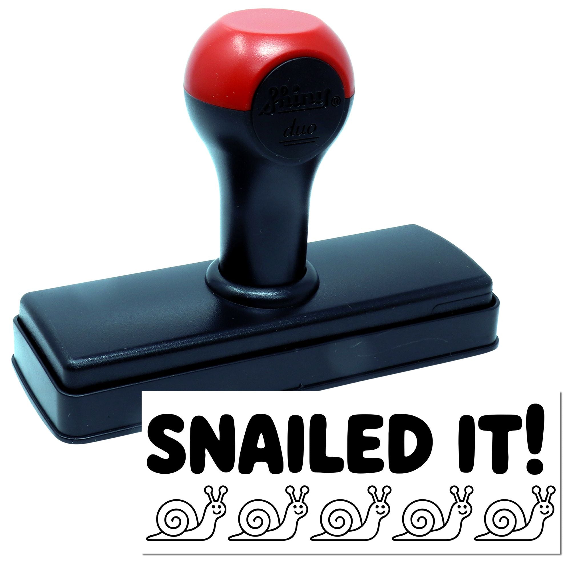 Red and black self-inking stamp and seal with SNAILED IT! text and snail icons.