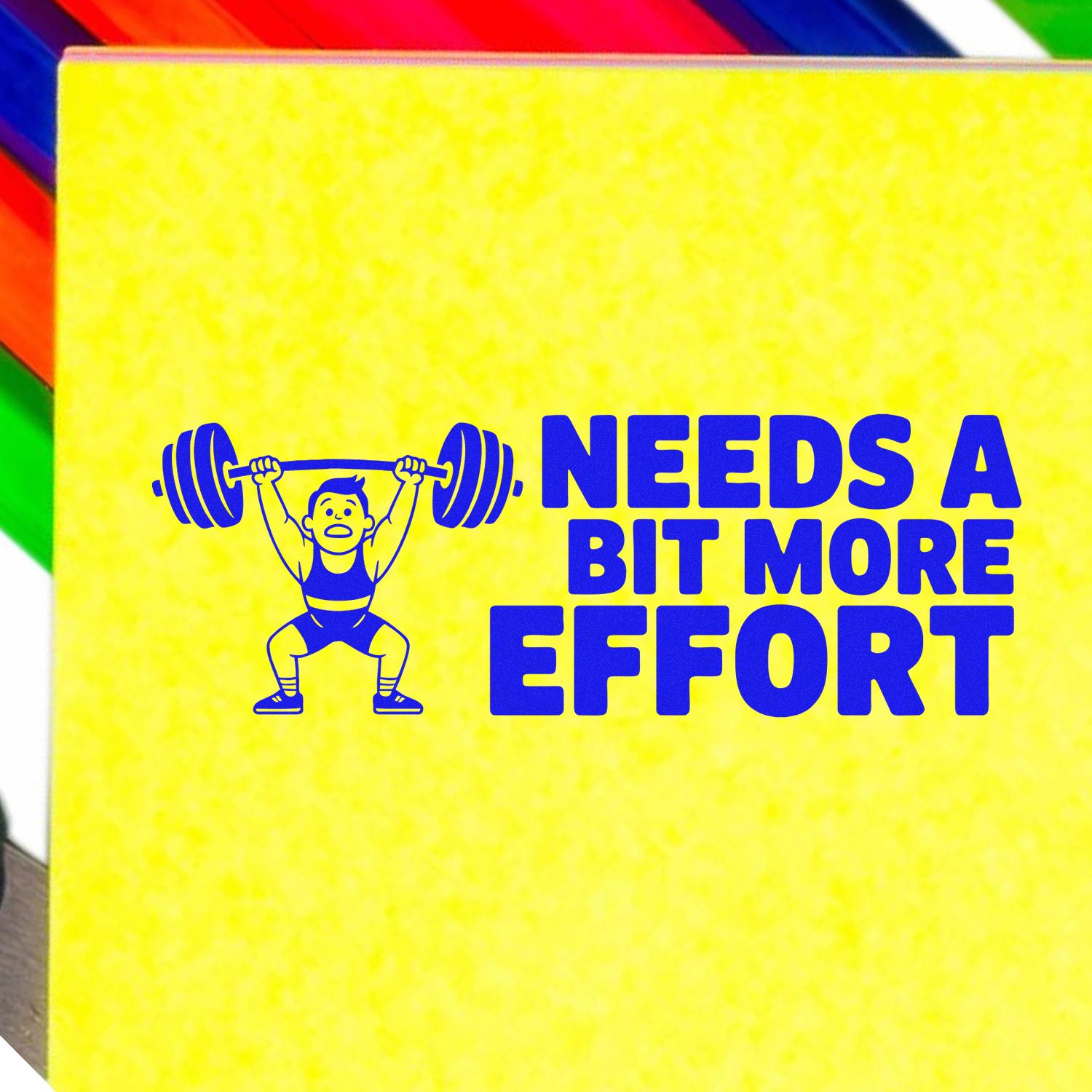 Bright yellow stamp seal with blue weightlifter graphic and bold text: Needs a bit more effort.
