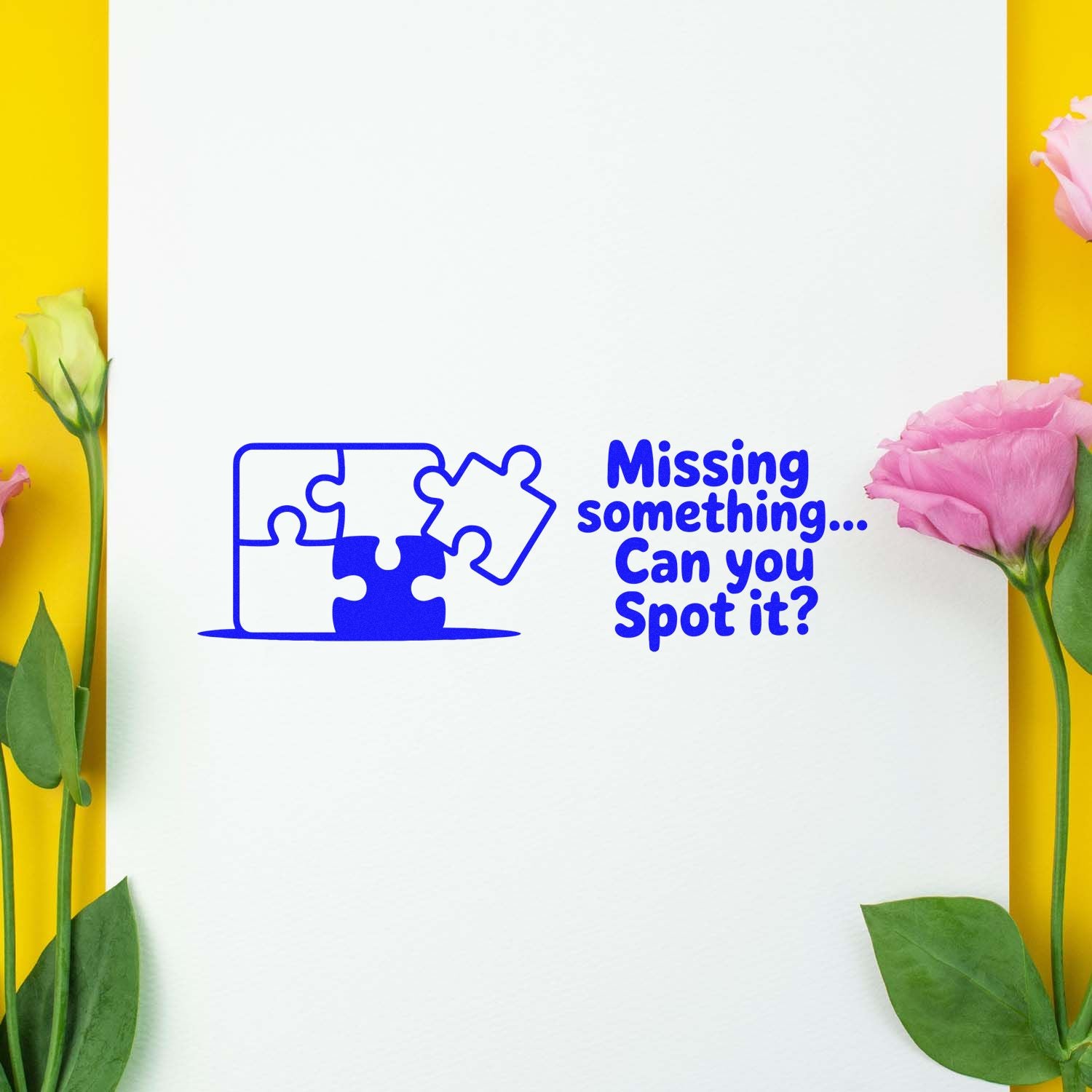 Blue puzzle-piece stamp seal reading Missing something... Can you Spot it? on white paper with pink flowers and yellow background.