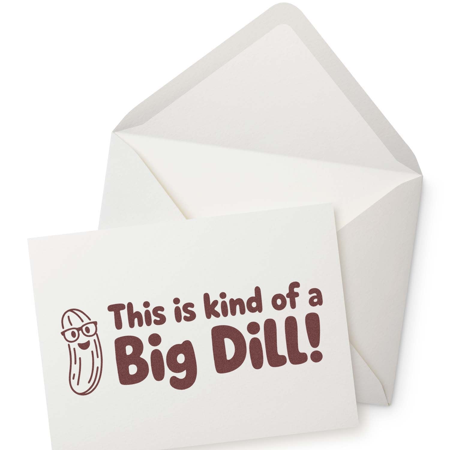 White stamp-and-seal card in envelope with brown This is kind of a Big Dill! text and smiling pickle cartoon.