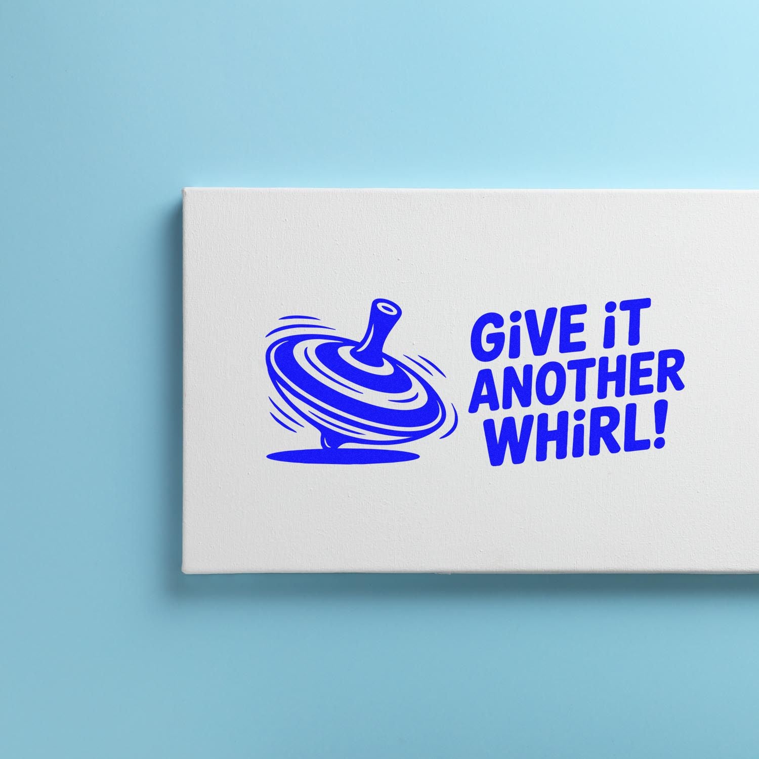 White stamp-and-seal packaging with blue swirl top graphic and GIVE IT ANOTHER WHIRL! on light blue background