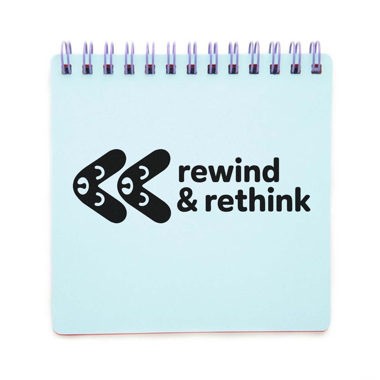 Light blue spiral-bound stamp and seal pad with black rewind & rethink logo.