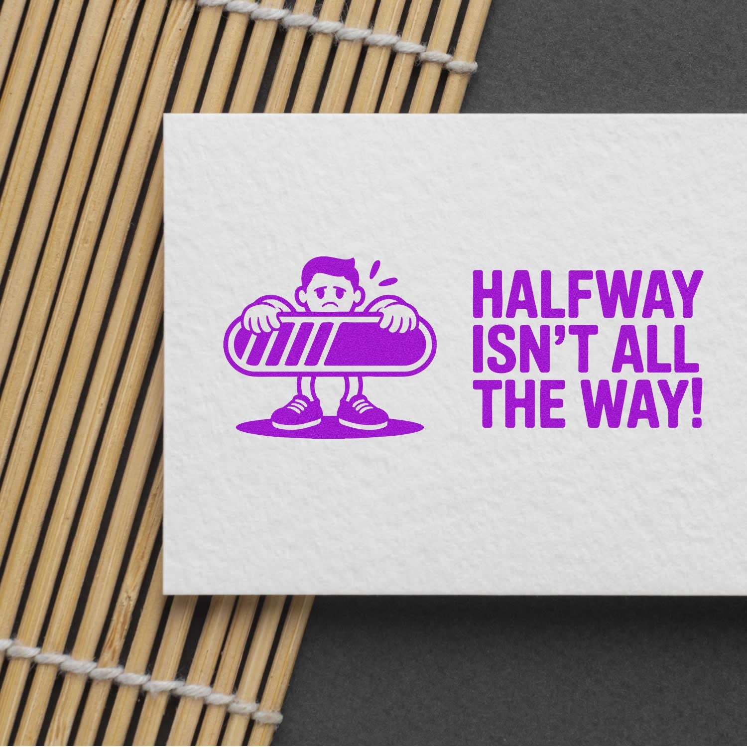 Purple stamp and seal design with a tired character holding a progress bar and the text Halfway isnt all the way!