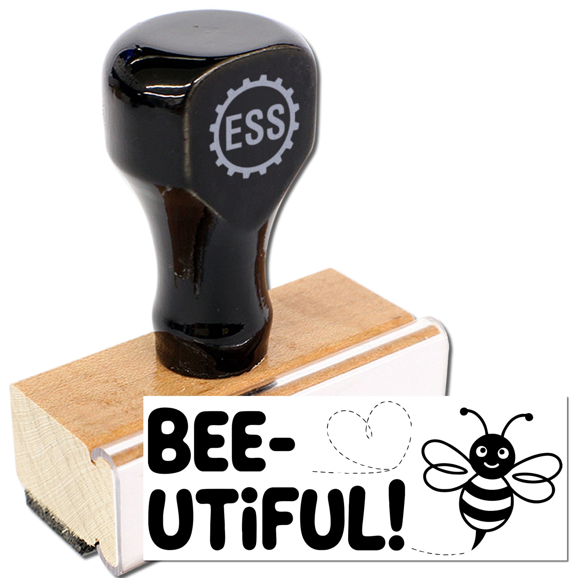 Black rubber stamp on wooden block with bee design, ESS logo, and BEE-UTIFUL! text on white background.