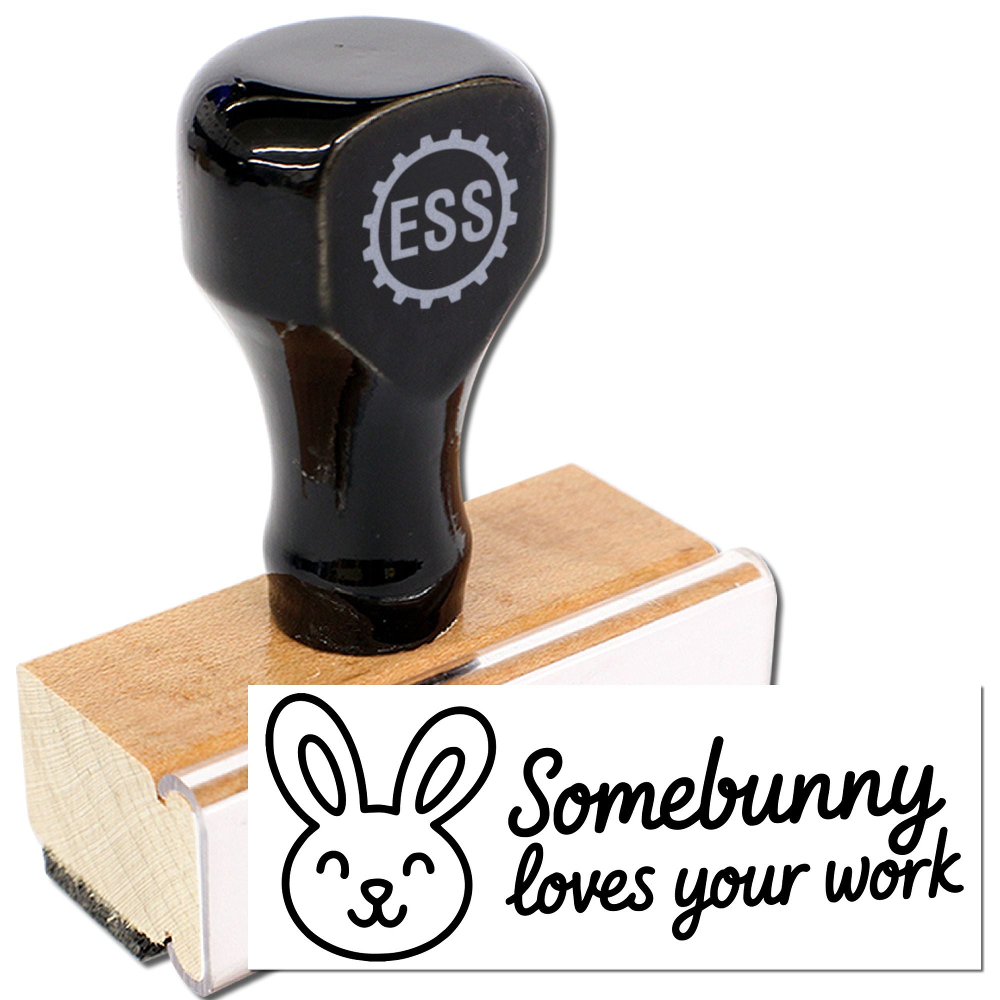 Black ESS rubber stamp and seal with wooden block beside a white bunny design reading Somebunny loves your work.