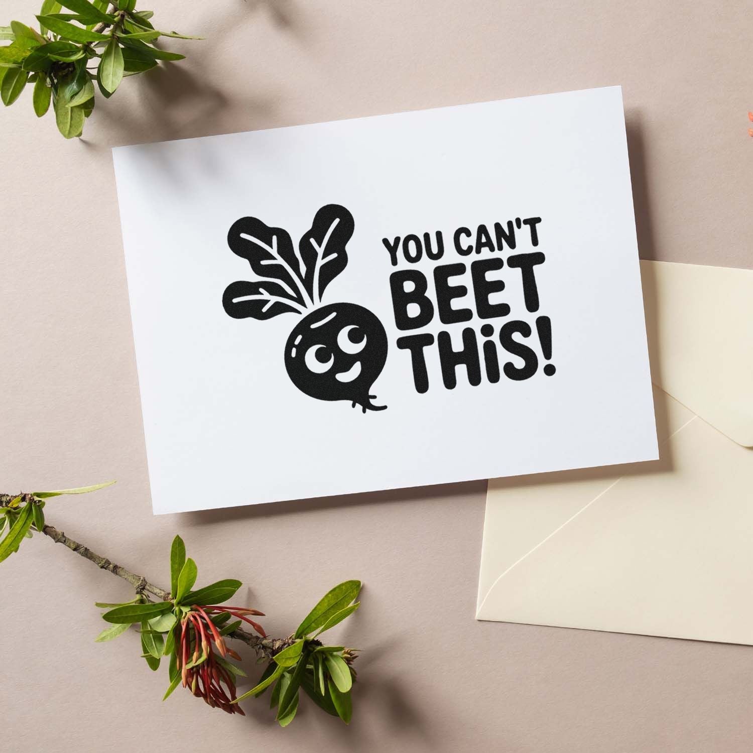 Black stamp and seal design with beet graphic and You cant beet this! on white card, with cream envelope and green leaves.
