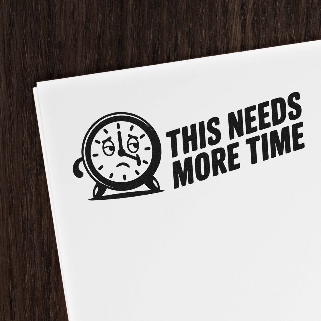 Black stamp seal design on white paper, sad clock face, and bold text THIS NEEDS MORE TIME.