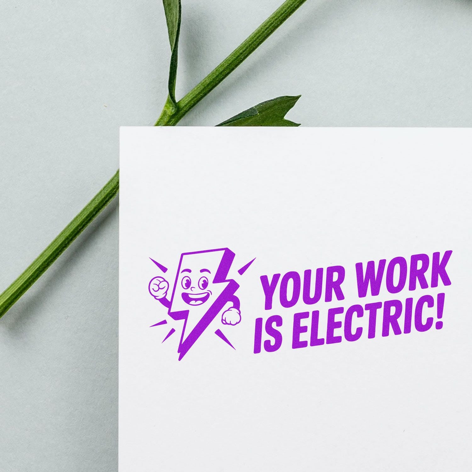 Purple stamp seal with lightning bolt mascot and Your Work Is Electric! on a white card, with green stems on a light background.