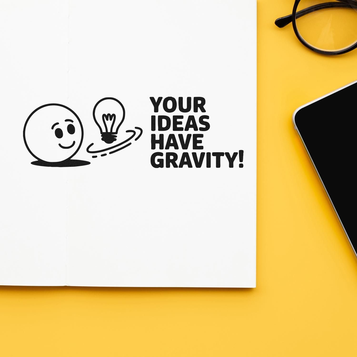 Black stamp and seal design with smiley, lightbulb and Your ideas have gravity! on white paper, on a yellow background.
