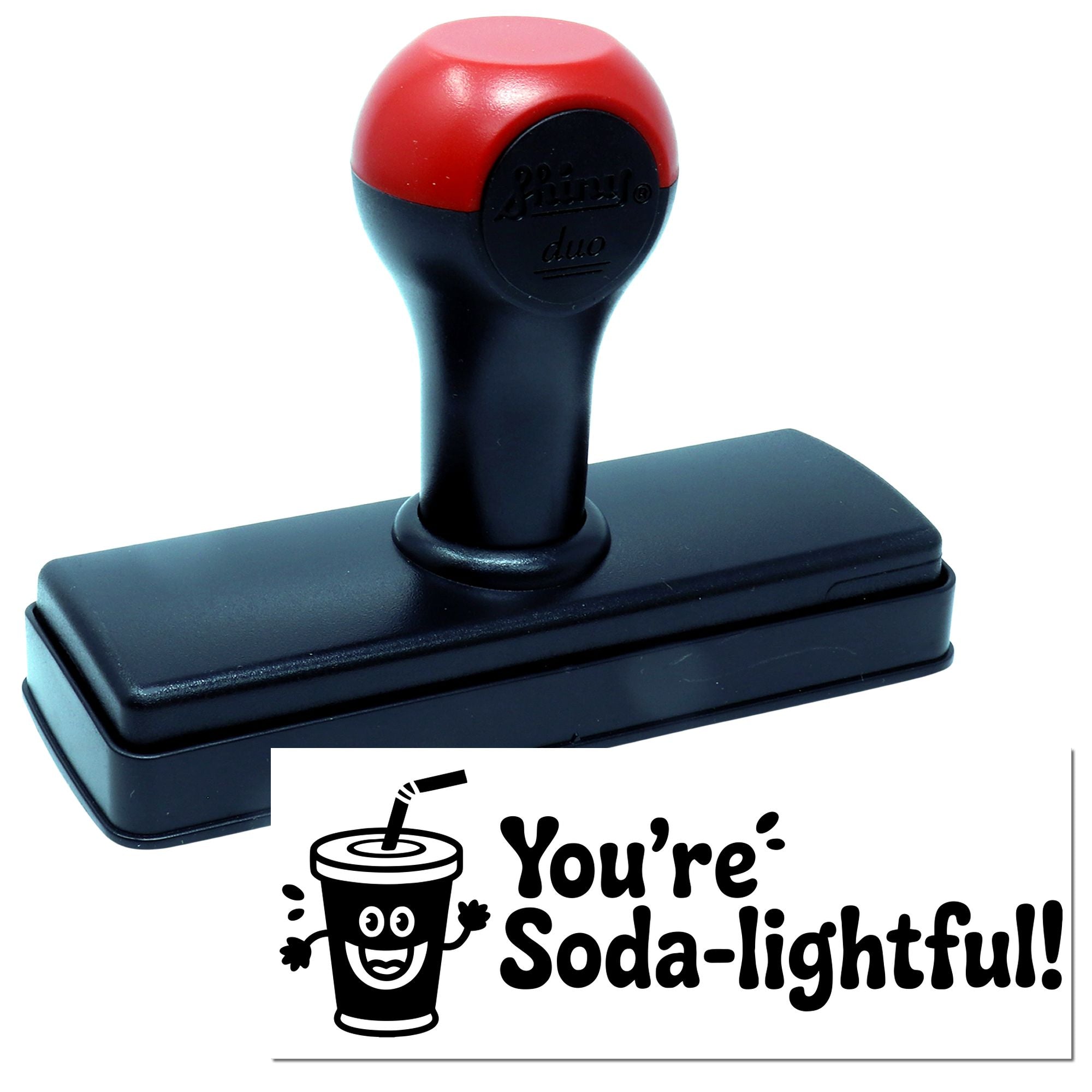 Red and black self-inking stamp with black base and seal reading Youre Soda-lightful! and a smiling soda cup.