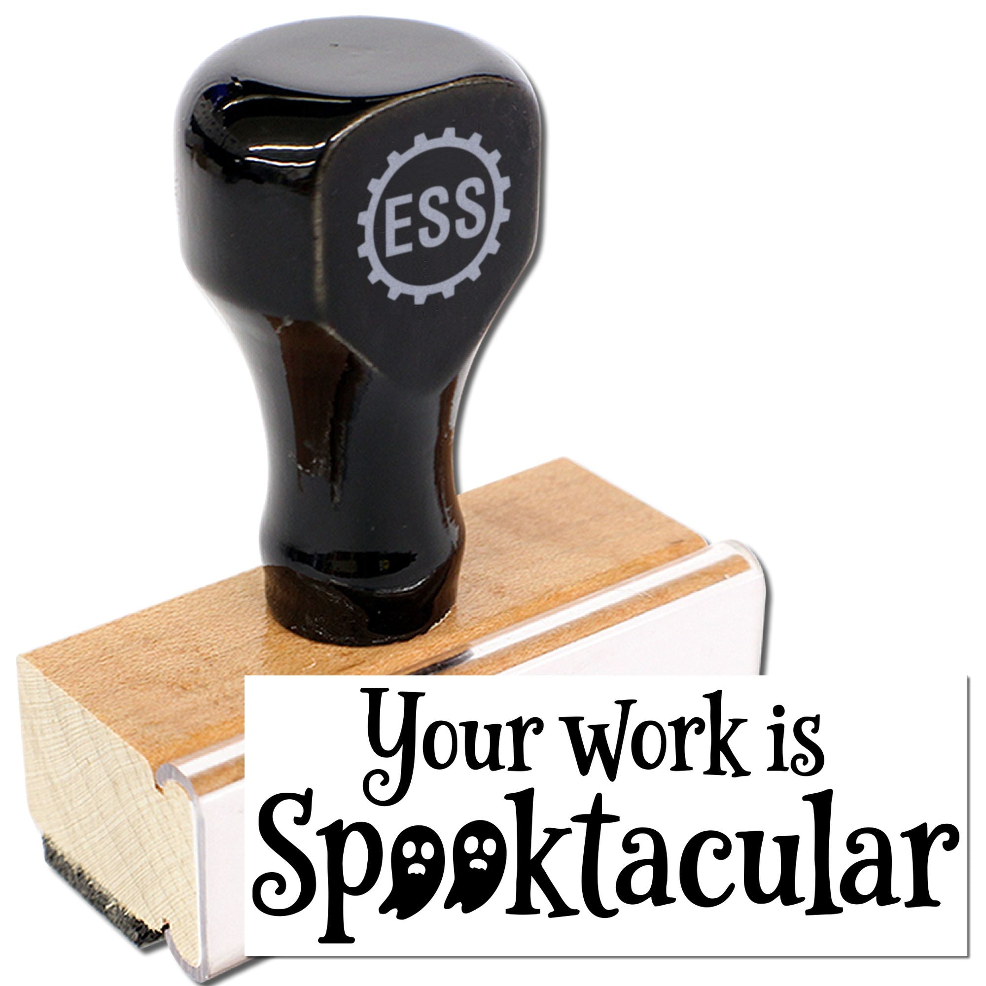 Black ESS stamp and seal with wooden block, printing Your work is Spooktacular in spooky serif lettering.
