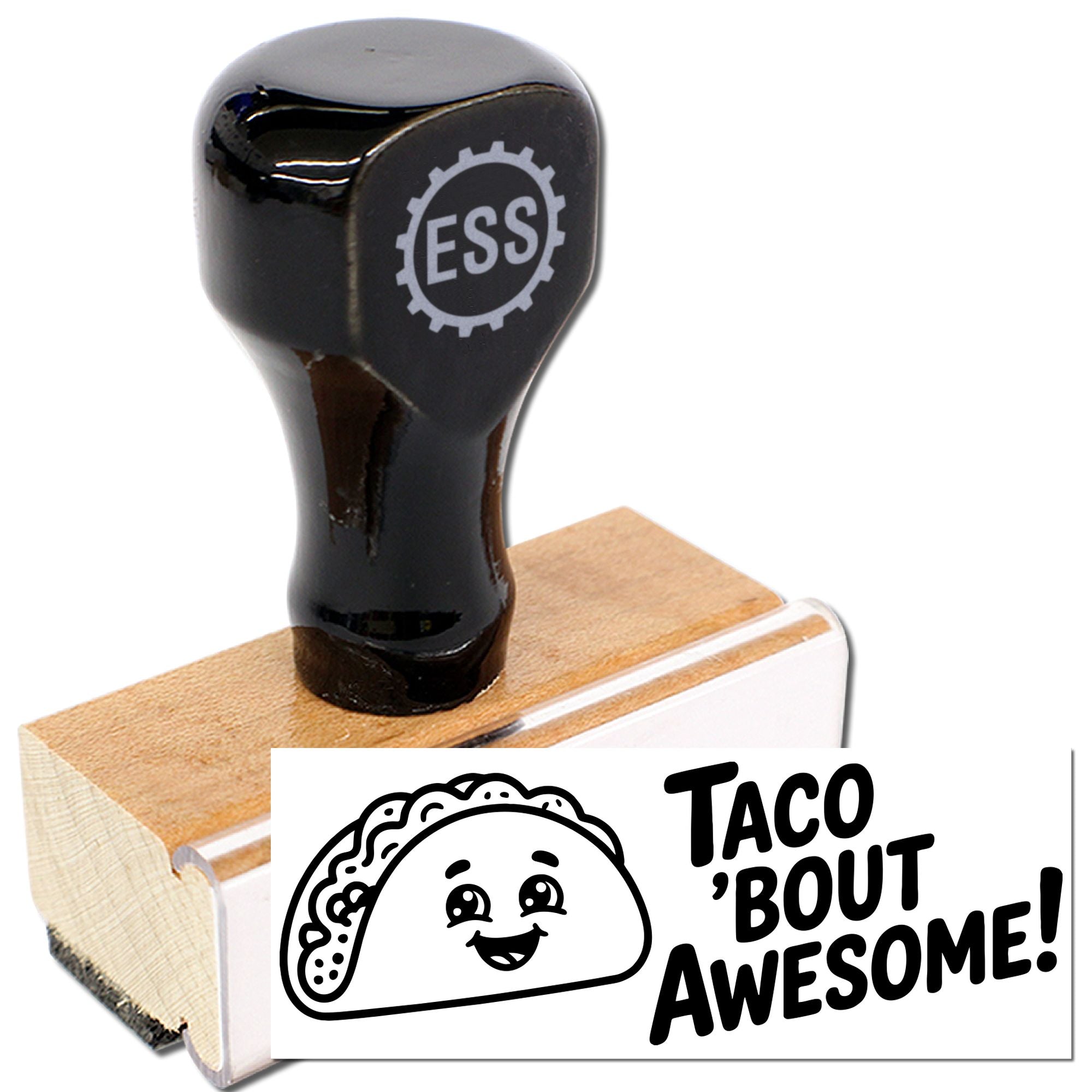 Black ESS rubber stamp and seal on wood block, printing a taco graphic and Taco Bout Awesome! in bold black.
