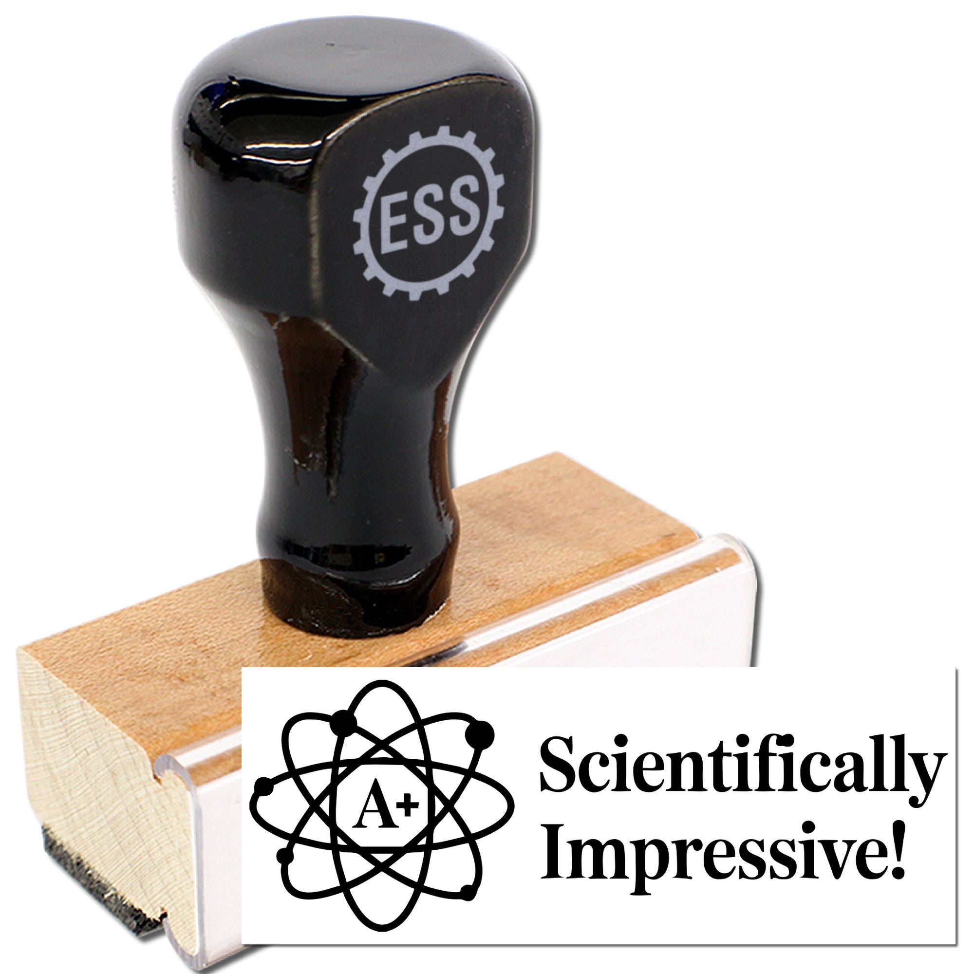 Black rubber stamp and seal on wooden base, with A+ atom design and white card reading Scientifically Impressive!