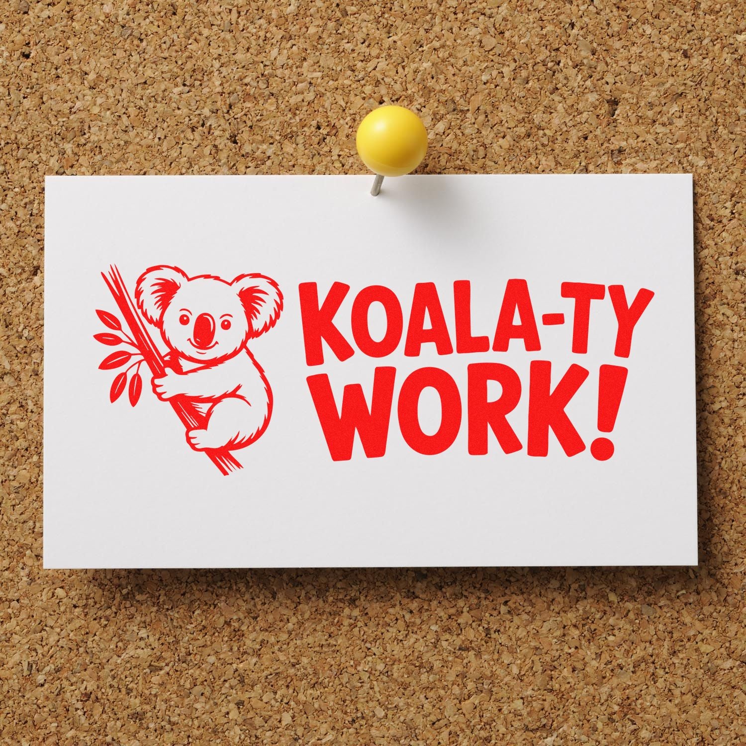 Red koala stamp and seal design with bold KOALA-TY WORK! text on white card pinned to corkboard.