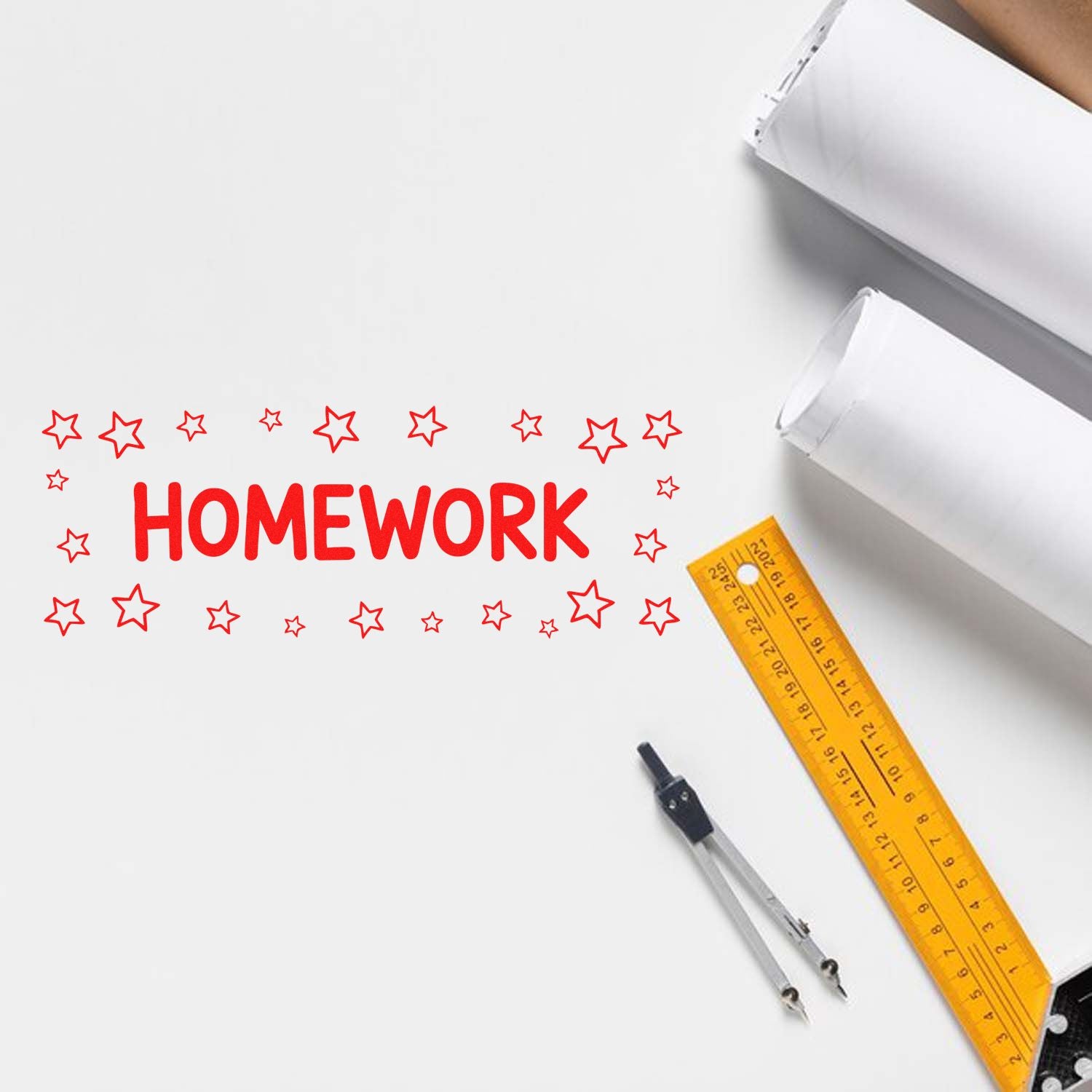 Red homework stamp and seal with star border on white paper, beside a yellow ruler and compass.