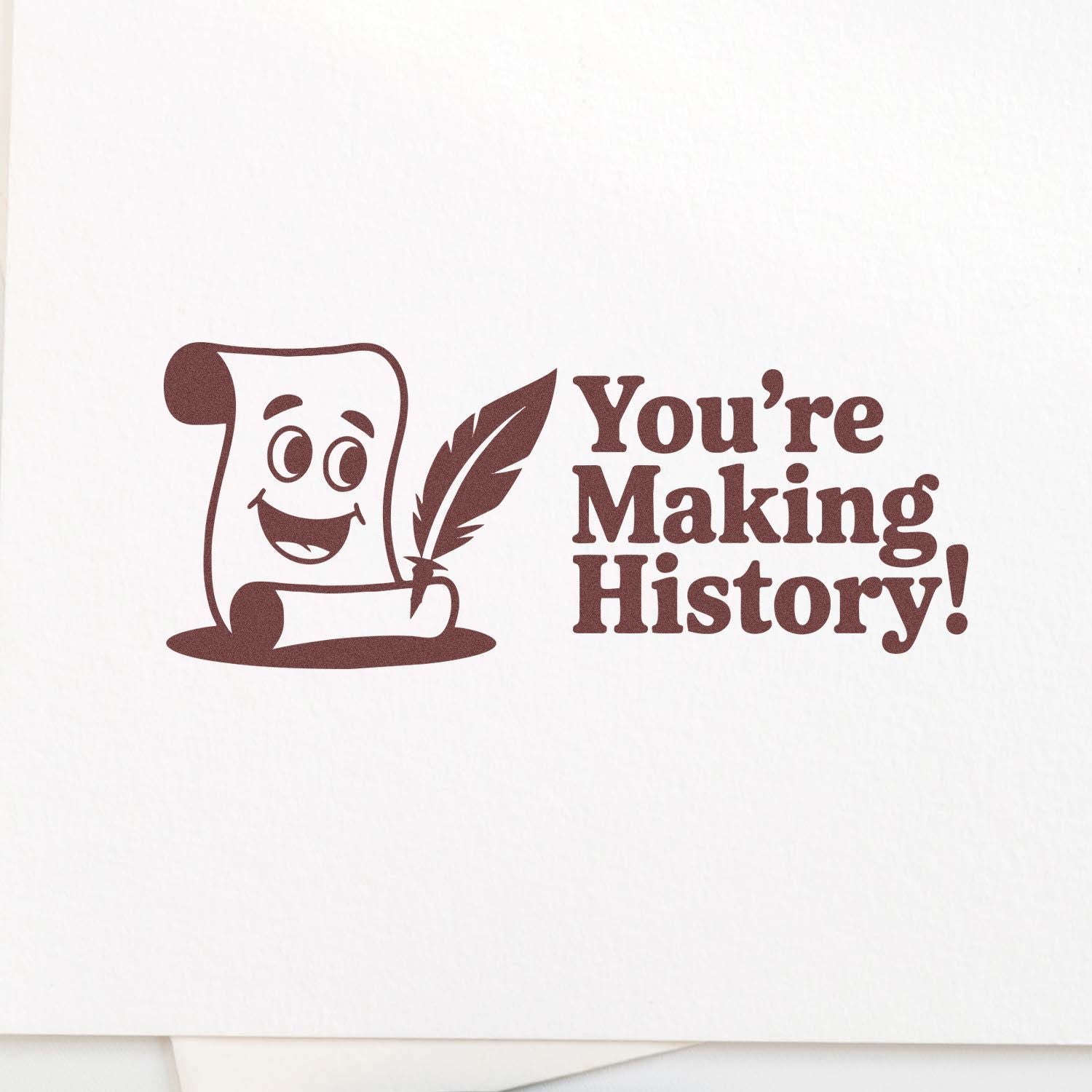 Brown rubber stamp design with a smiling parchment scroll and quill, reading Youre Making History! on white background.