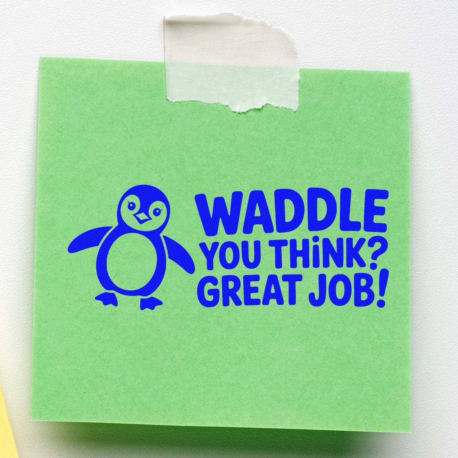 Green sticky note stamp with blue penguin and WADDLE YOU THINK? GREAT JOB! text, taped at the top.