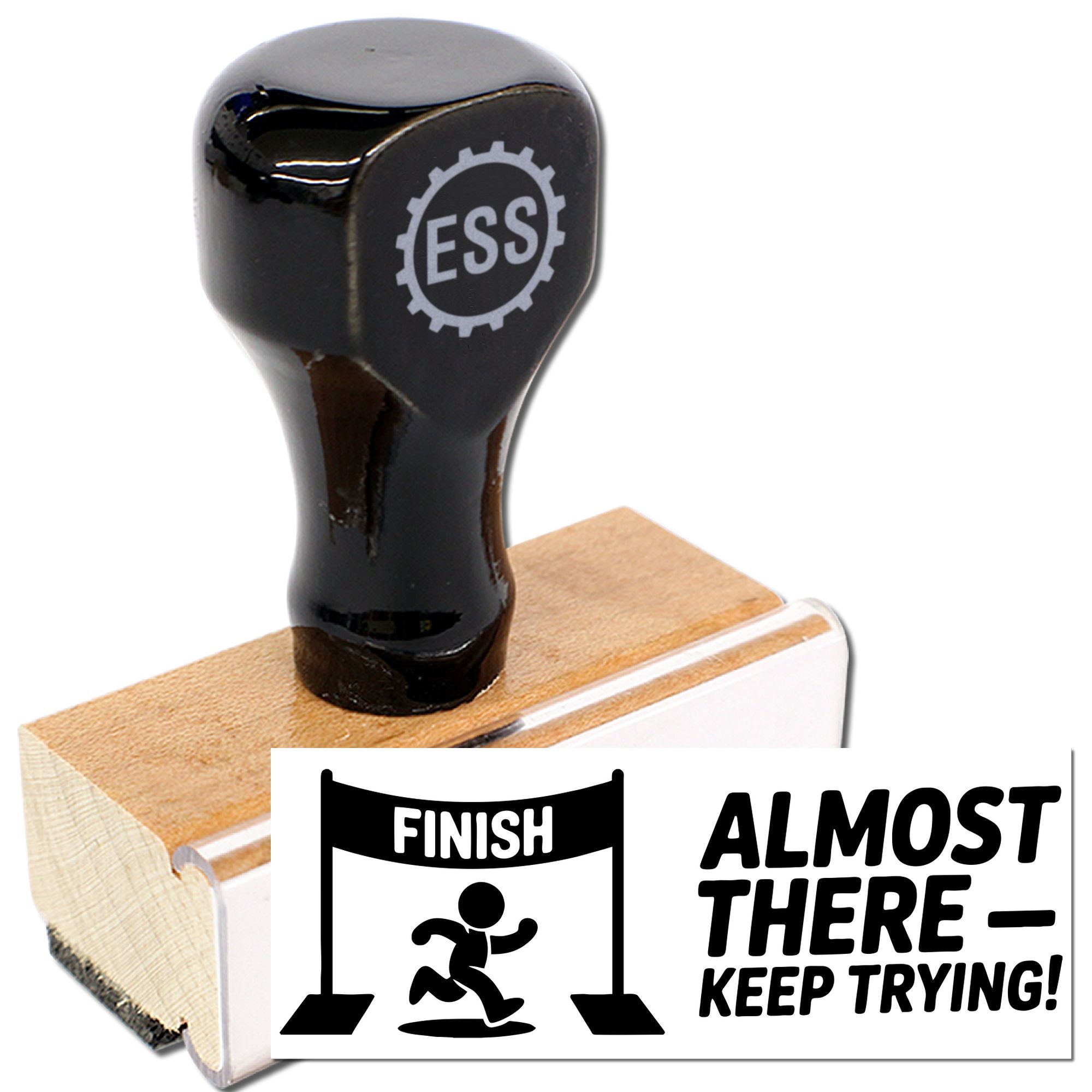 Black self-inking stamp on wooden base with EES logo, showing finish and almost there, keep trying impressions.