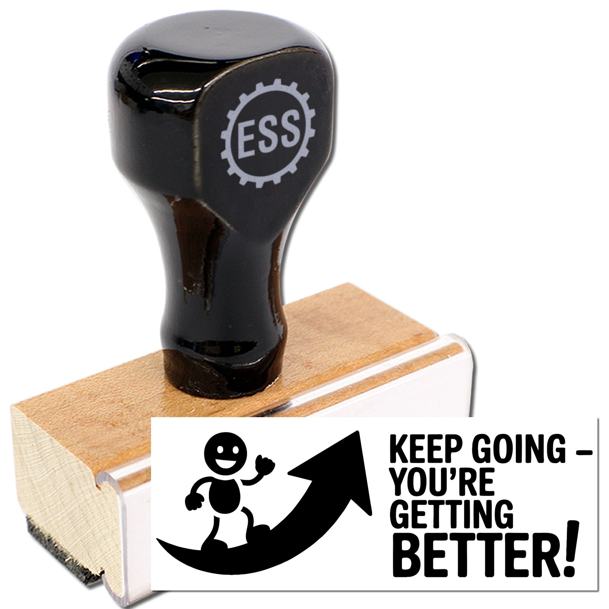 Black ESS rubber stamp on wooden mount with white seal reading Keep goingyoure getting better!