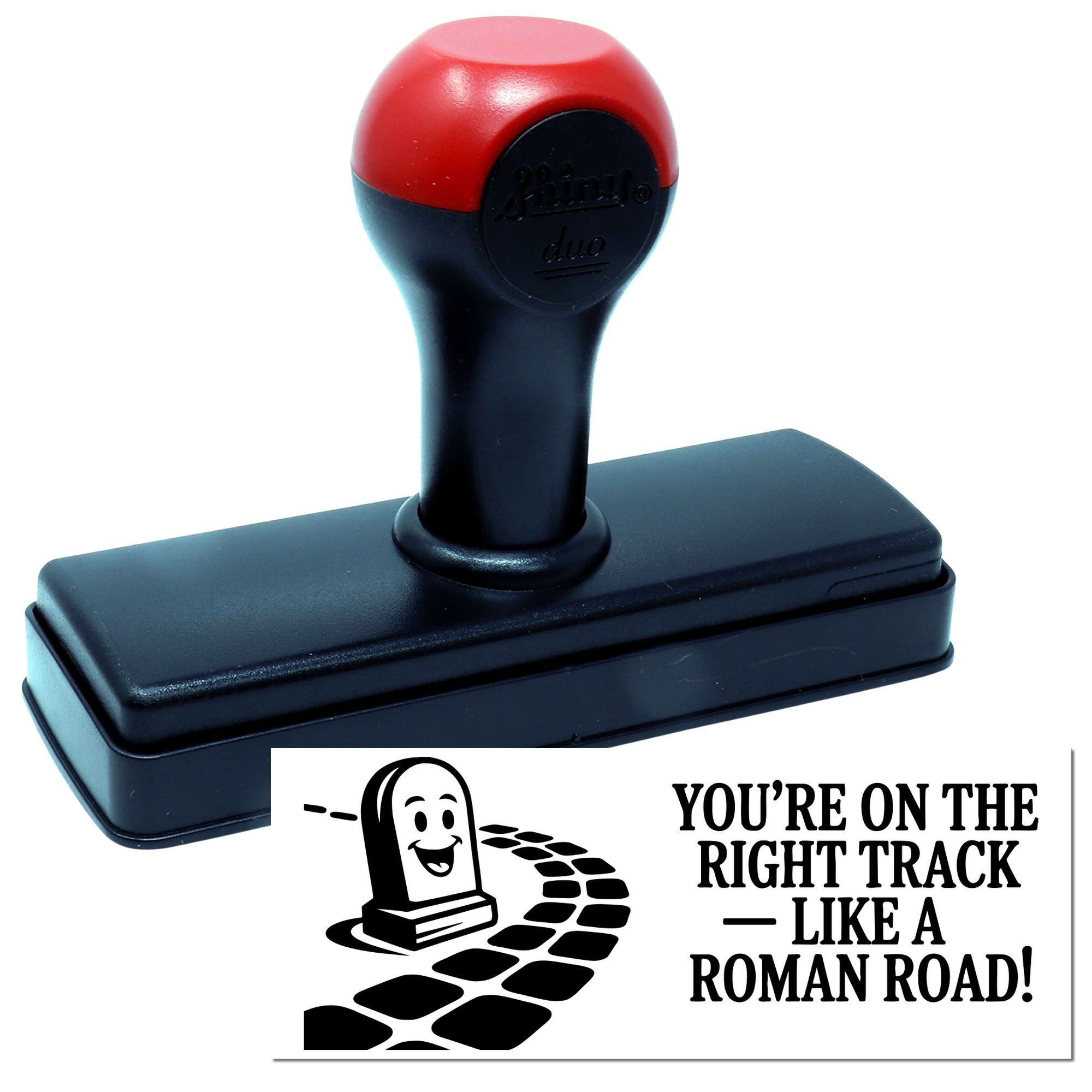 Red and black self-inking stamp and seal with smiling seal graphic and Roman road slogan.