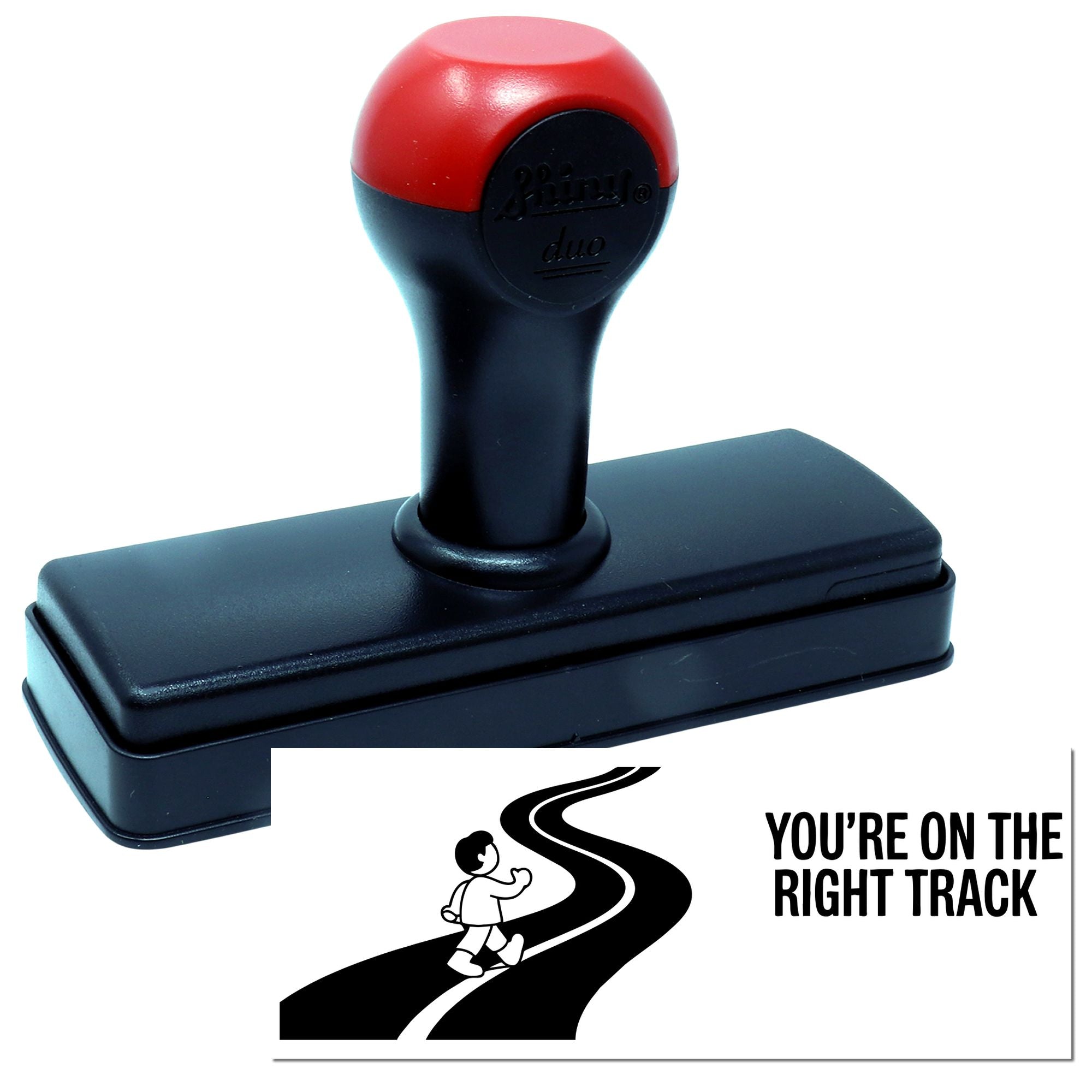 Red-and-black self-inking stamp and seal with bold black base, showing Youre on the Right Track road graphic.