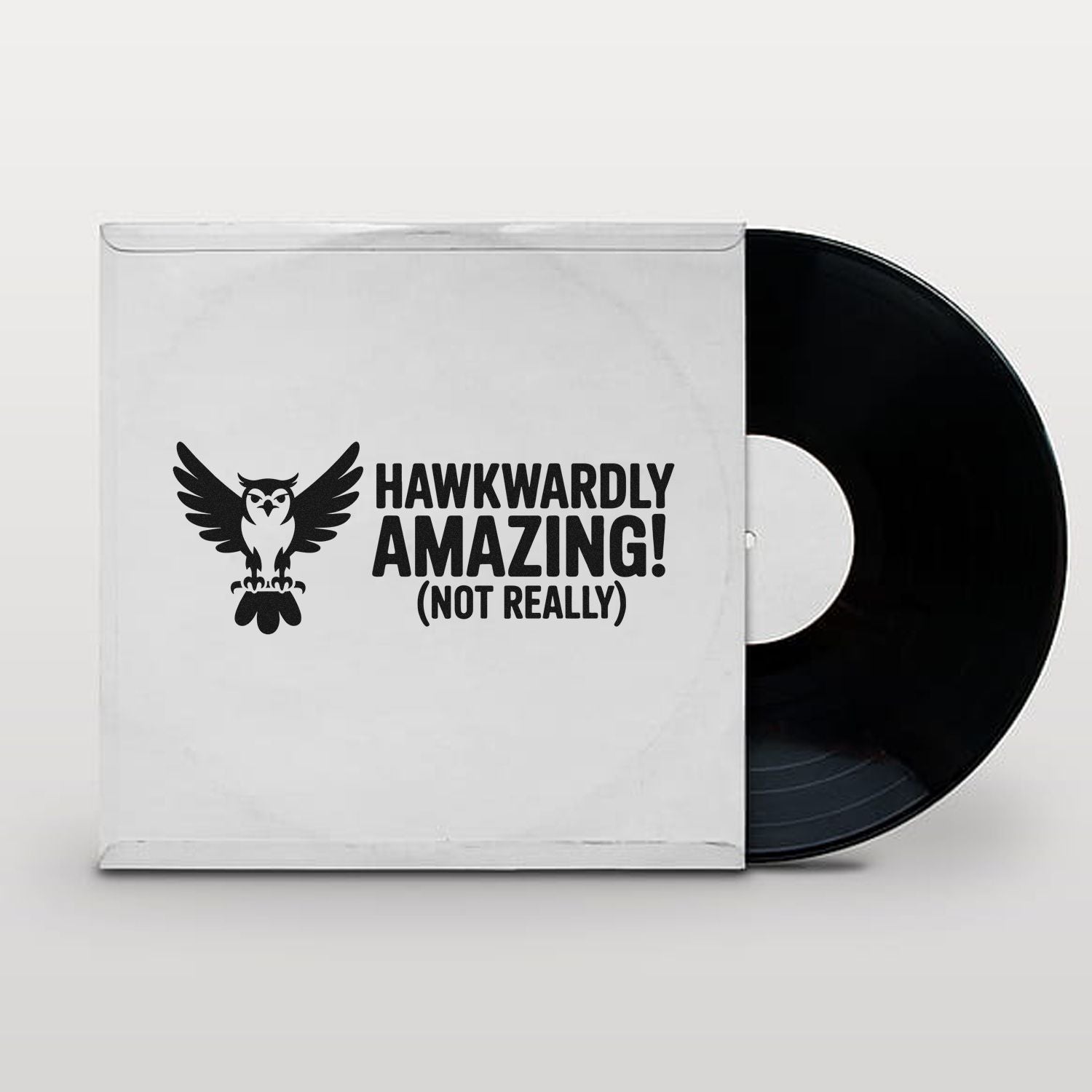 White stamp-and-seal sleeve with black owl graphic and Hawkwardly Amazing! (Not Really) beside a black vinyl disc.