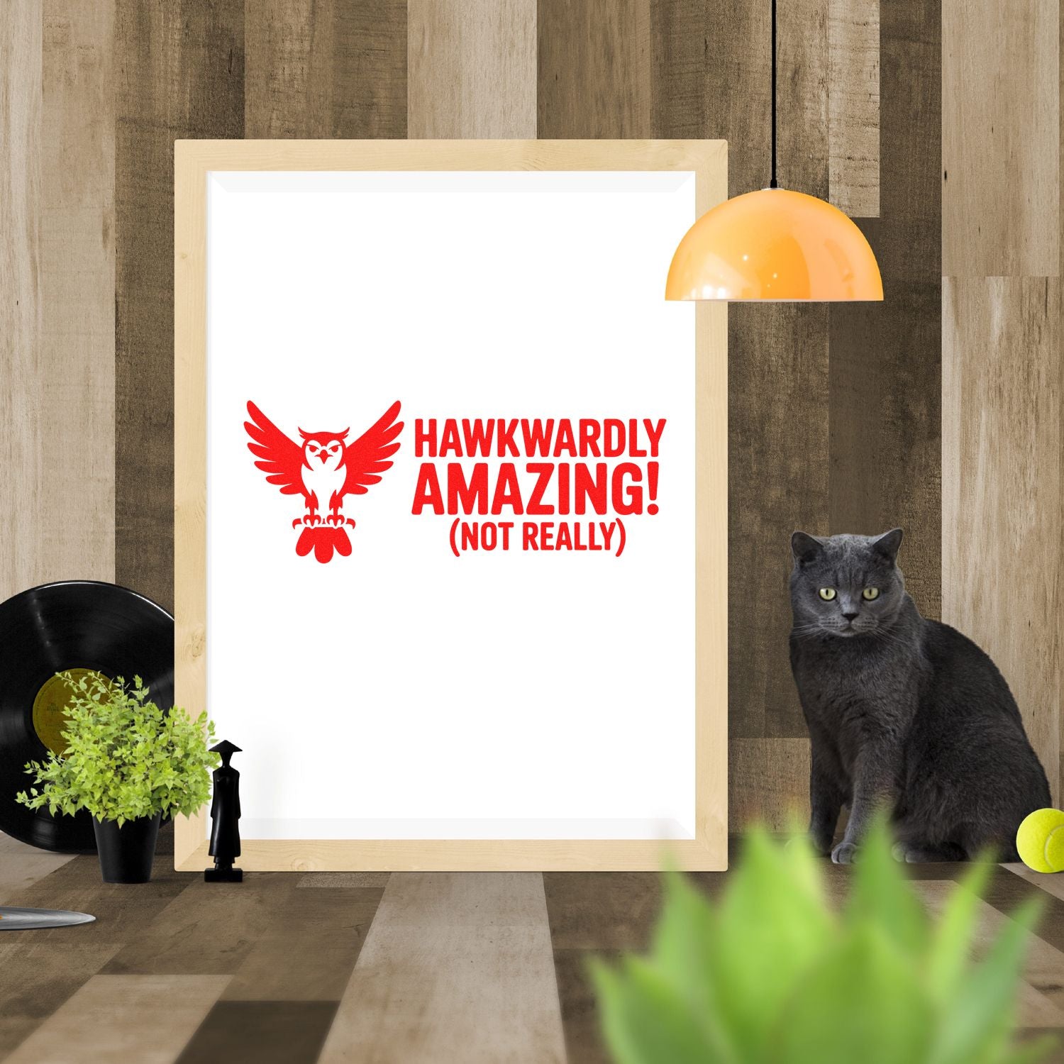 Red owl stamp seal design with bold Hawkwardly Amazing! (Not Really) text on a white framed print.