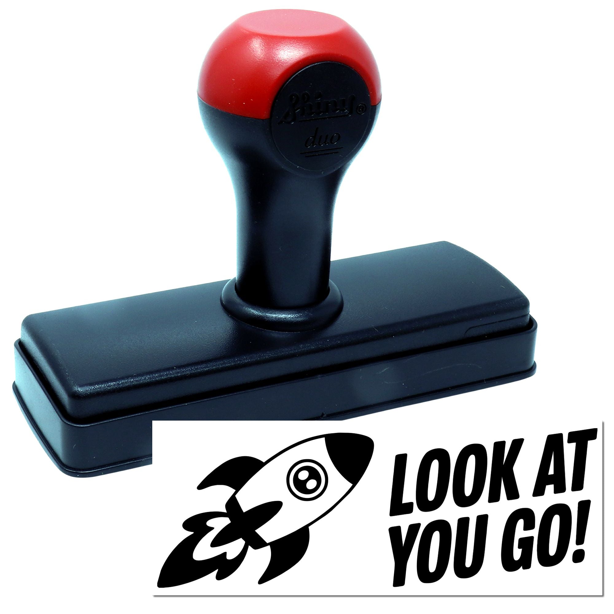 Red-and-black self-inking stamp and seal with rectangular base and rocket logo, reading LOOK AT YOU GO!
