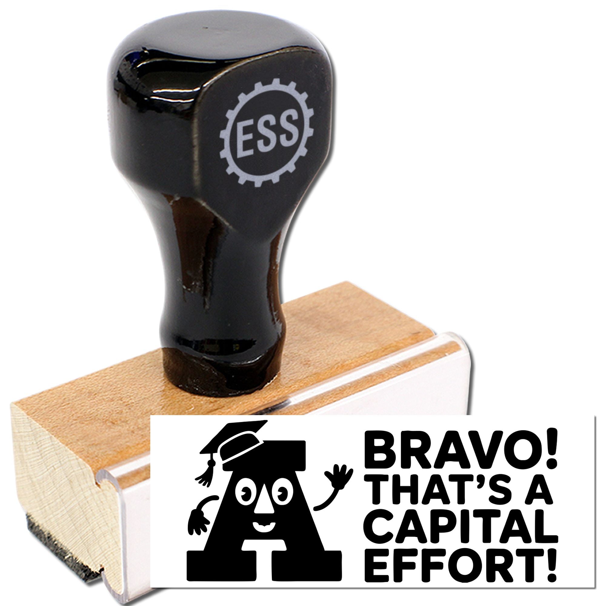 Black rubber stamp and seal on wooden block, with ESS logo and bold BRAVO! THATS A CAPITAL EFFORT! imprint.