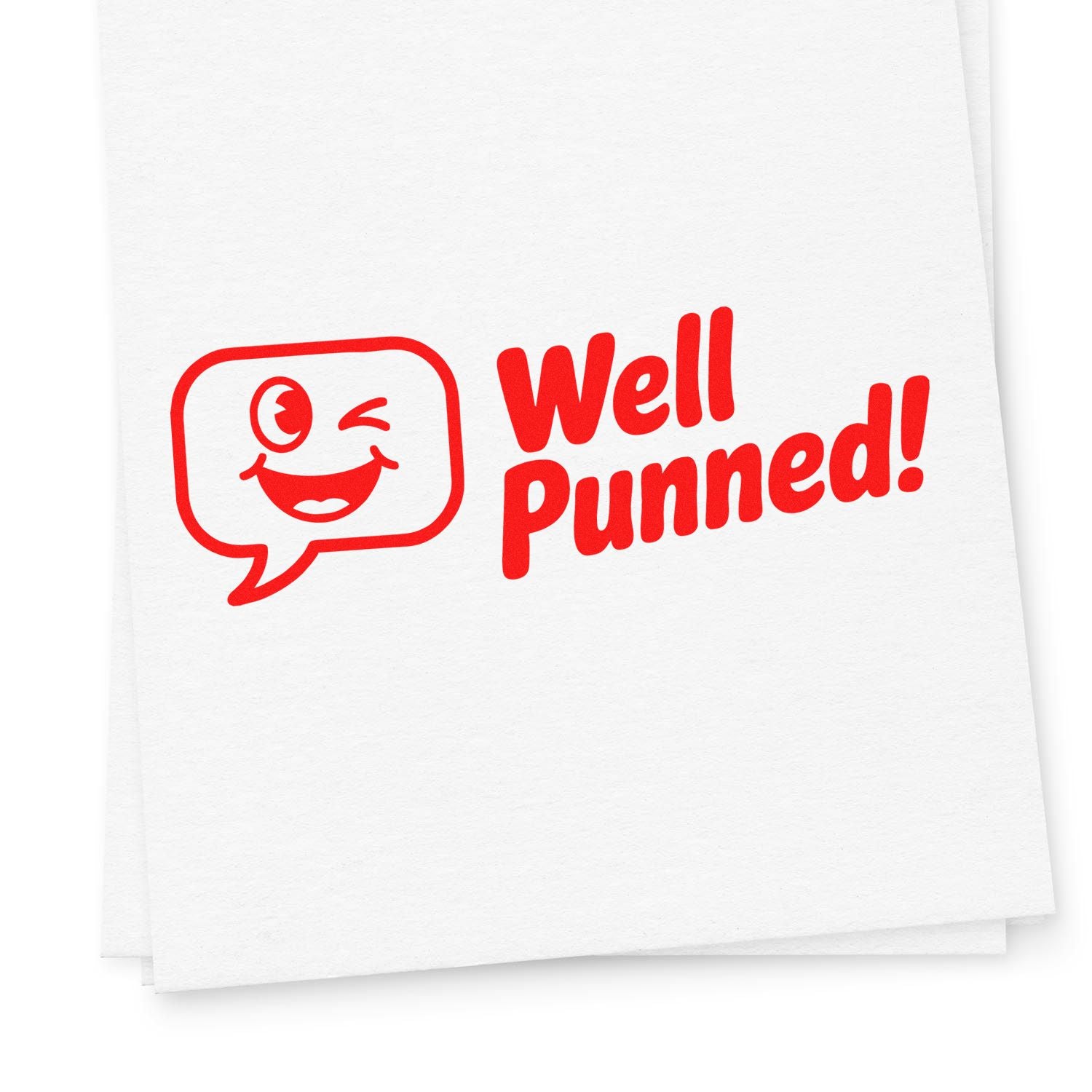 Red Well Punned! stamp seal with winking speech-bubble face on white paper