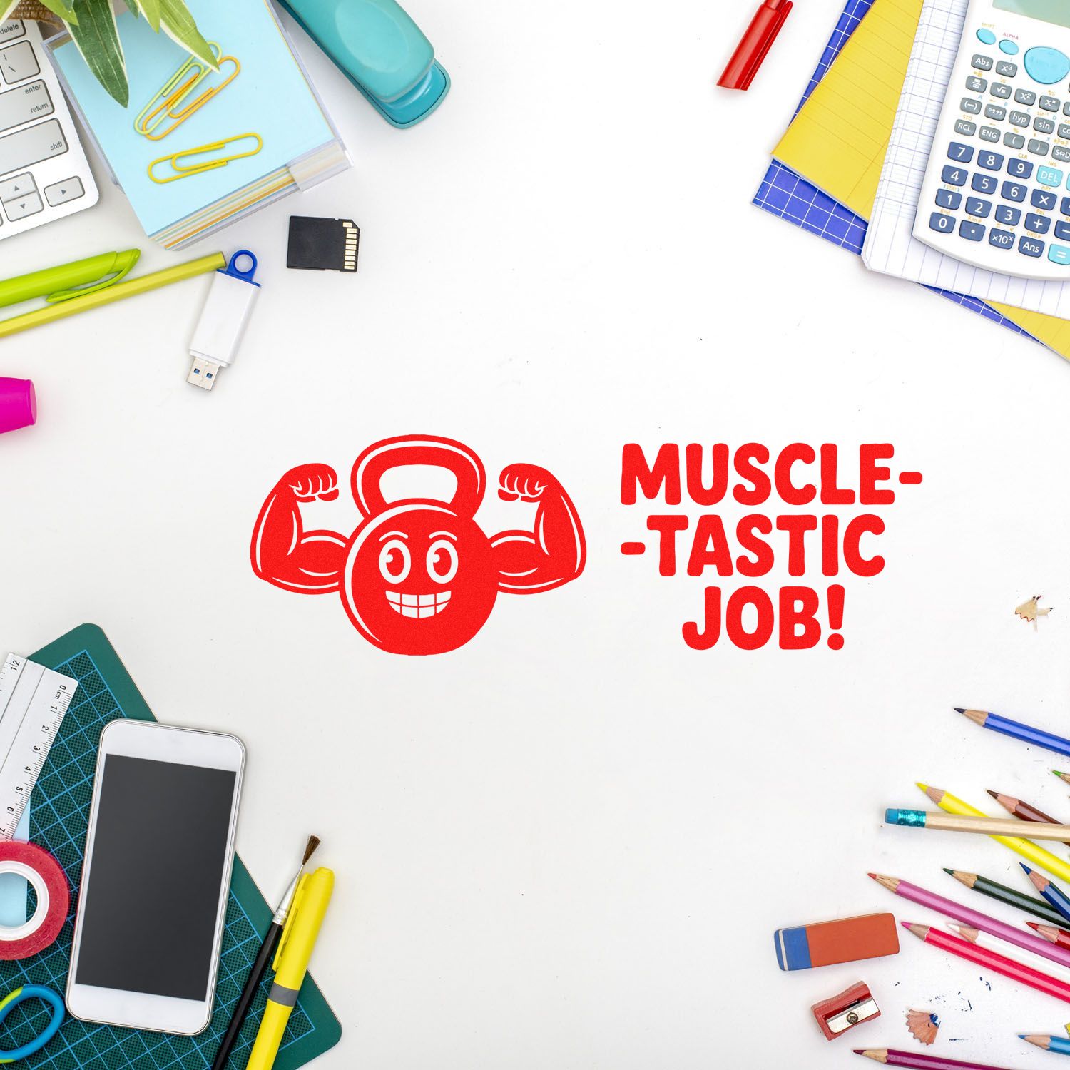 Red rubber stamp seal with flexing kettlebell and Muscle-tastic job! on white desk, framed by colorful school supplies.