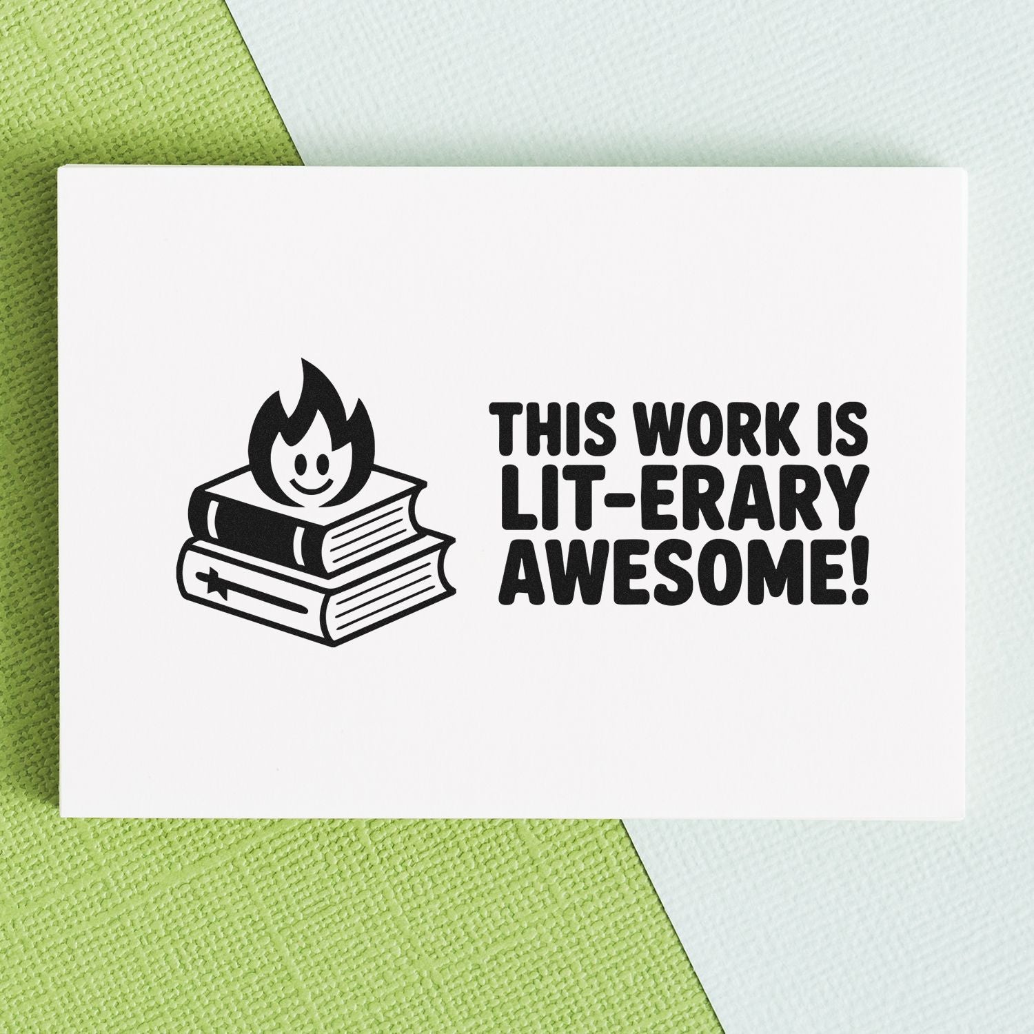 Black literary-themed stamp seal on white card, with smiling flame over books and This work is lit-erary awesome! on green background.