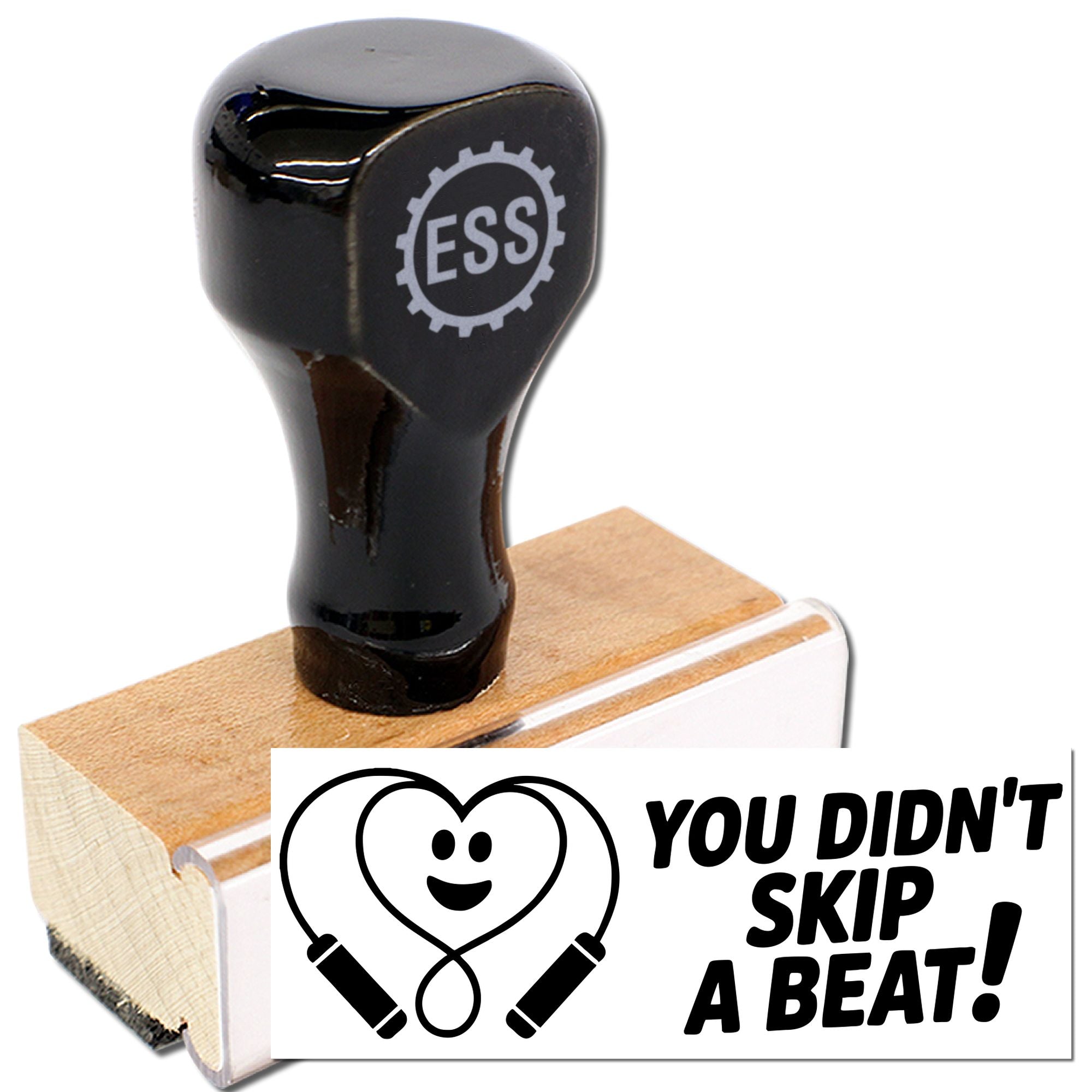Black ESS stamp and seal on a wooden block, with a heart jump-rope design and You Didnt Skip a Beat! in bold black text.