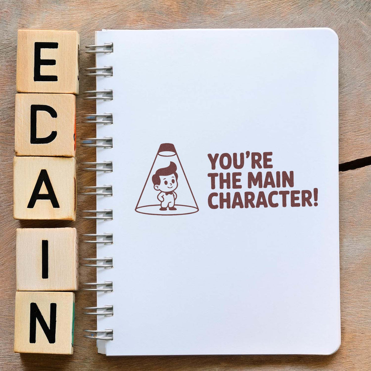 Acorn You've Got Character motivational rubber stock stamp in use, showing bold text on a wooden handle.