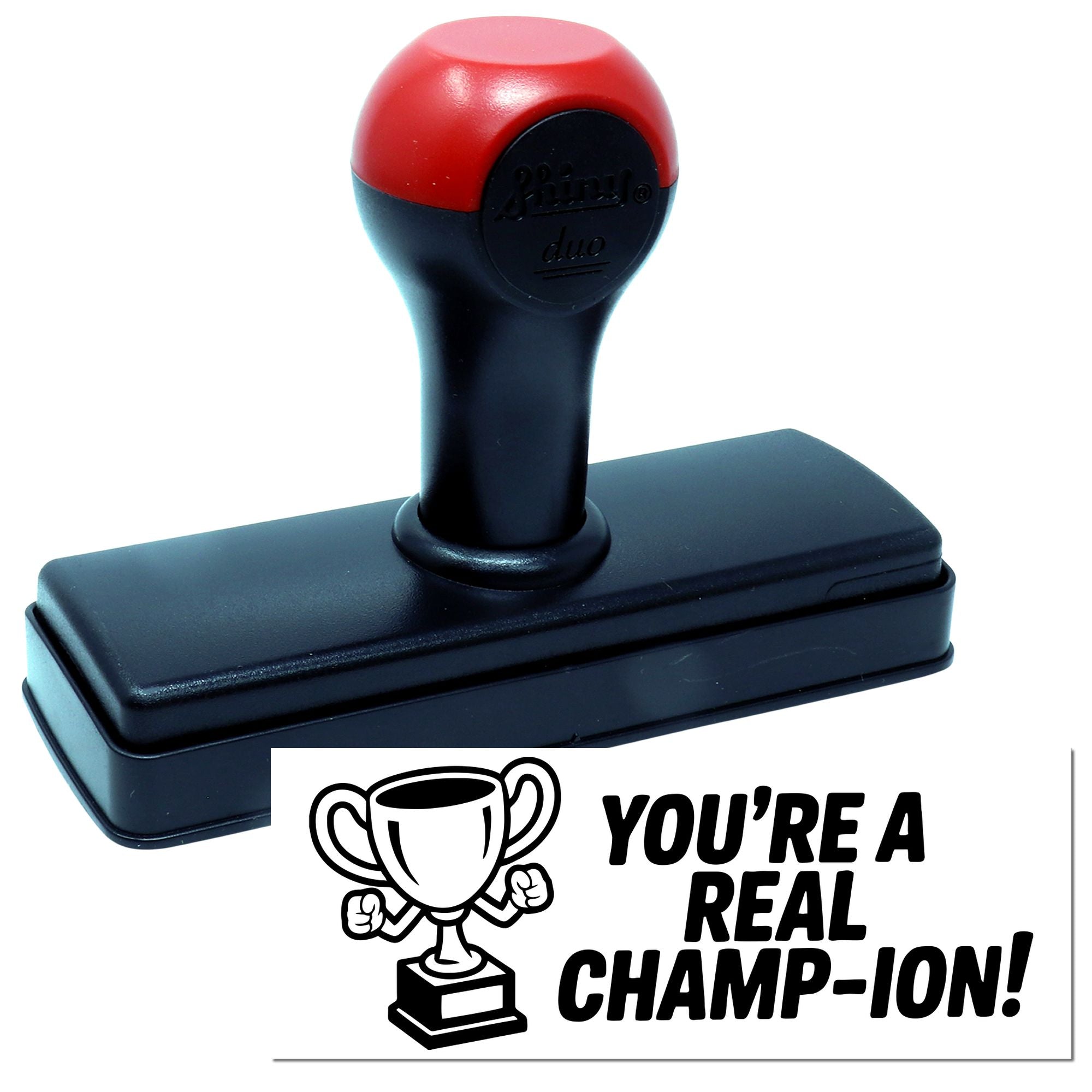 Black and red self-inking stamp and seal with trophy design and text, YOURE A REAL CHAMP-ION!