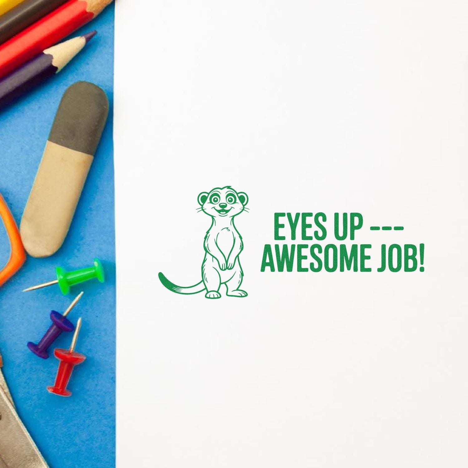 Green stamp and seal with meerkat and EYES UP --- AWESOME JOB! beside colored pencils and pushpins.