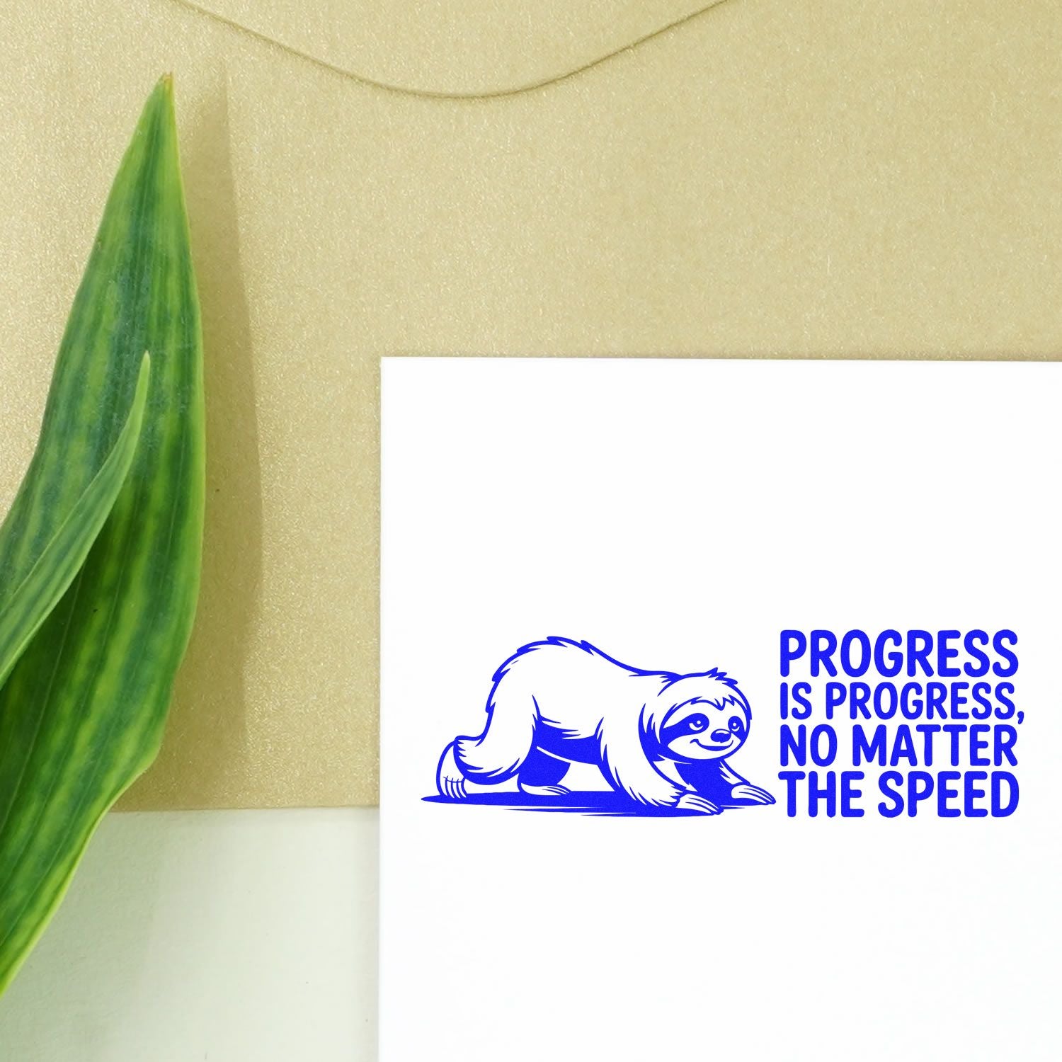 Blue sloth rubber stamp design with Progress is progress, no matter the speed on a white card, beige background, green leaf