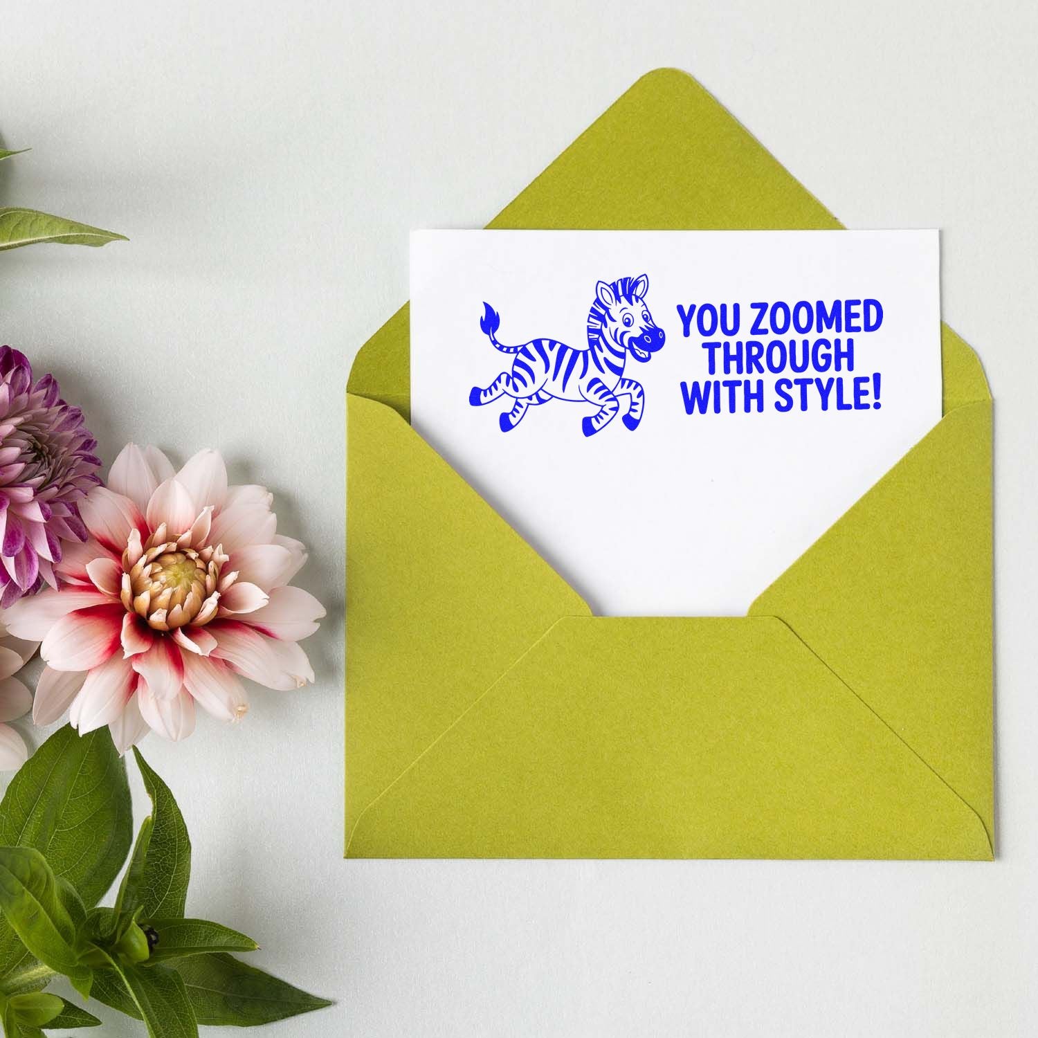 Blue zebra stamp and seal on white card in a lime green envelope, with You zoomed through with style! and pink flowers.